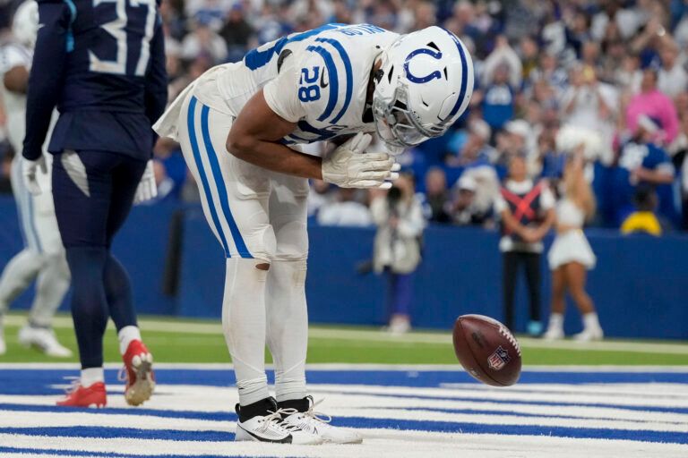 Indianapolis Colts running back Jonathan Taylor (28) celebrates after rushing for a touchdown during a game against the Tennessee Titans at Lucas Oil Stadium.