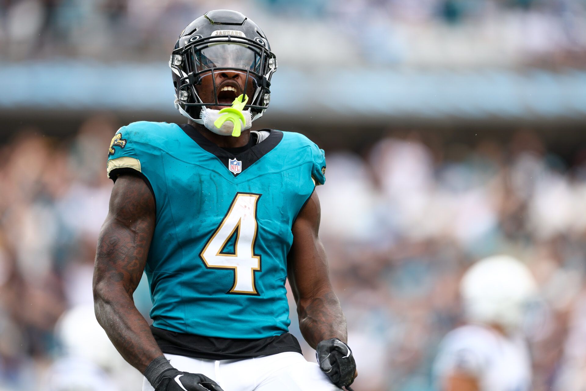 Jacksonville Jaguars running back Tank Bigsby (4) celebrates after a touchdown against the Indianapolis Colts in the third quarter at EverBank Stadium.