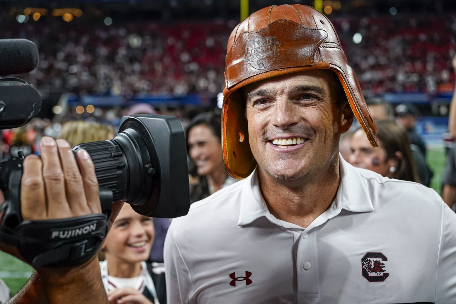 South Carolina Gamecocks head coach Shane Beamer wears the Old Leather Helmet after defeating the Virginia Tech Hokies at Mercedes-Benz Stadium.