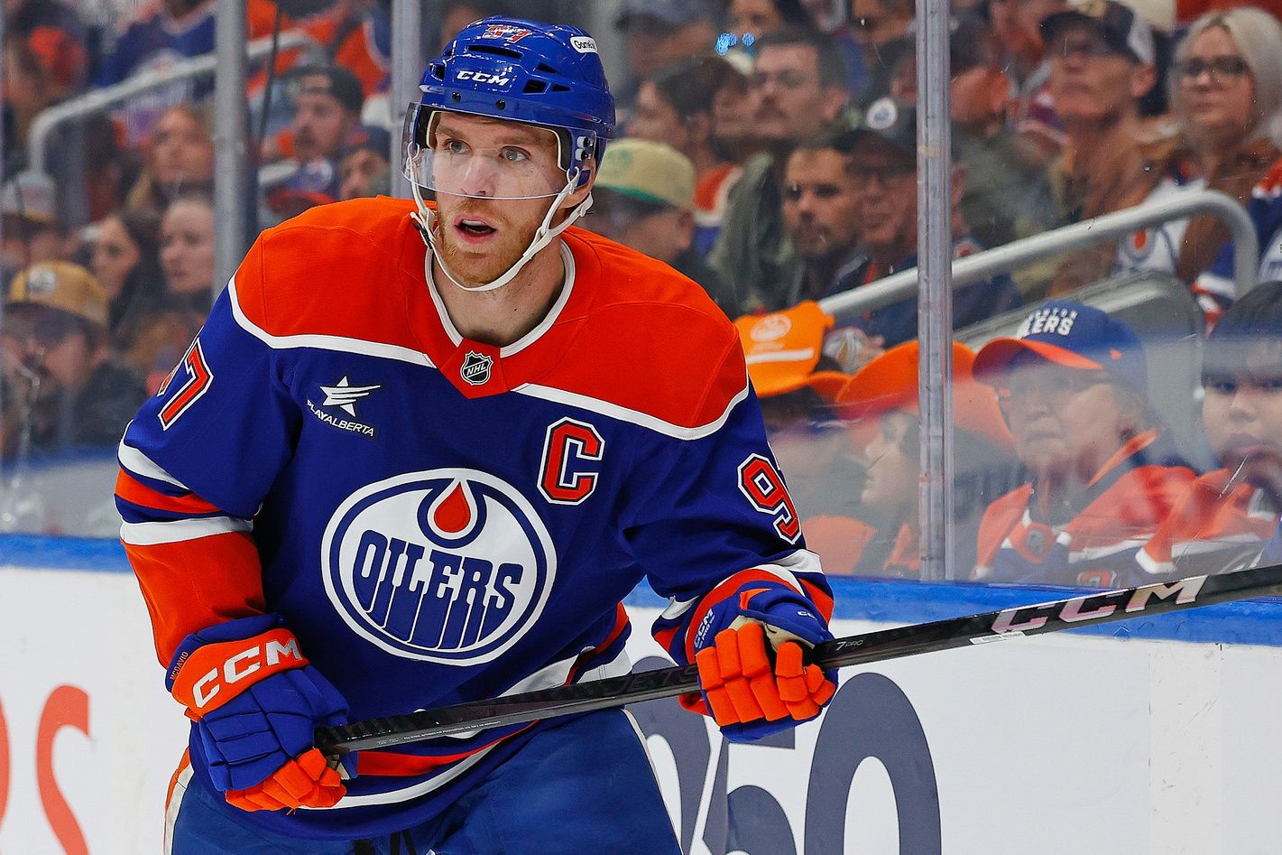 Edmonton Oilers forward Connor McDavid (97) looks for a loose puck against the New York Islanders at Rogers Place.
