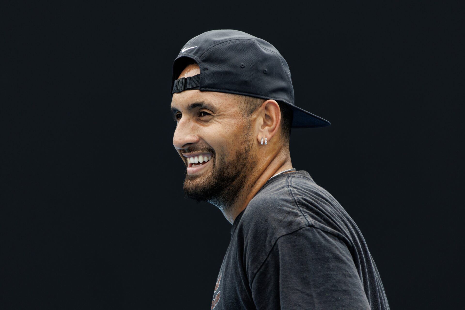 Nick Kyrgios of Australia laughs during a practice session on court 16 at Melbourne Park.