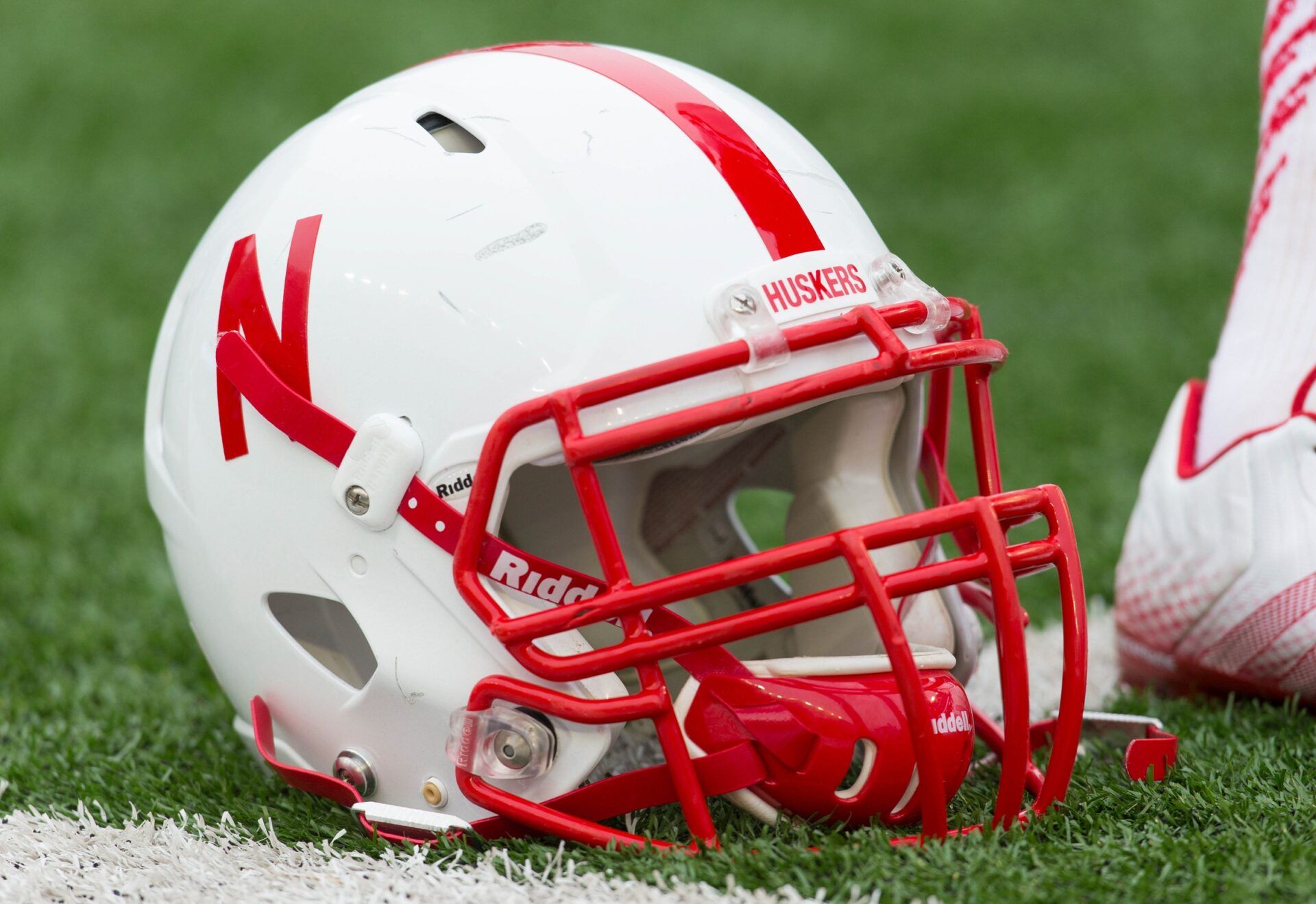 A Nebraska Cornhuskers helmet sits on the field during warmups prior to the game against the Wisconsin Badgers at Camp Randall Stadium.  Wisconsin won 59-24.