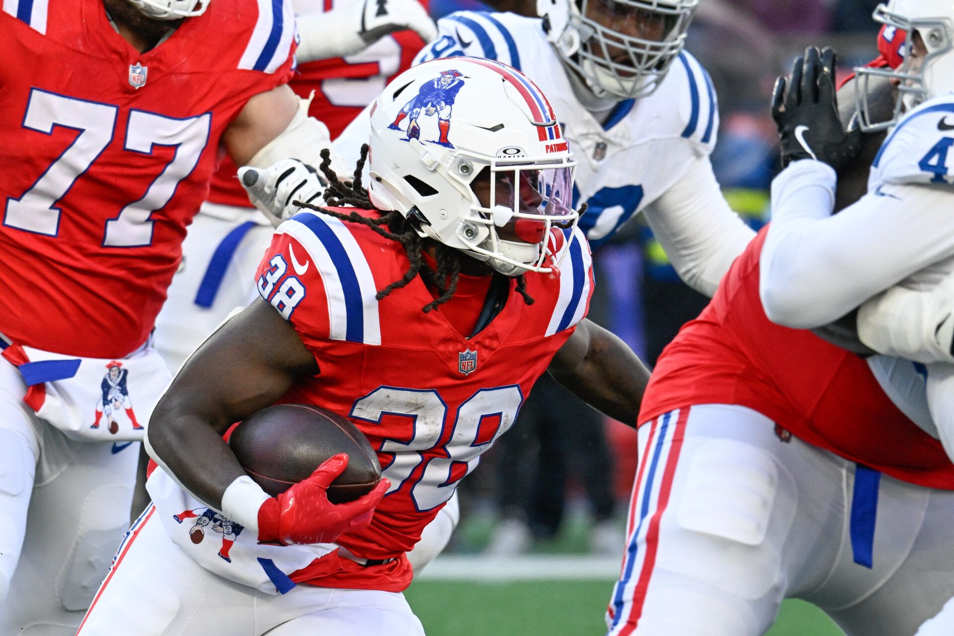New England Patriots running back Rhamondre Stevenson (38) runs the ball against the Indianapolis Colts during the second half at Gillette Stadium.