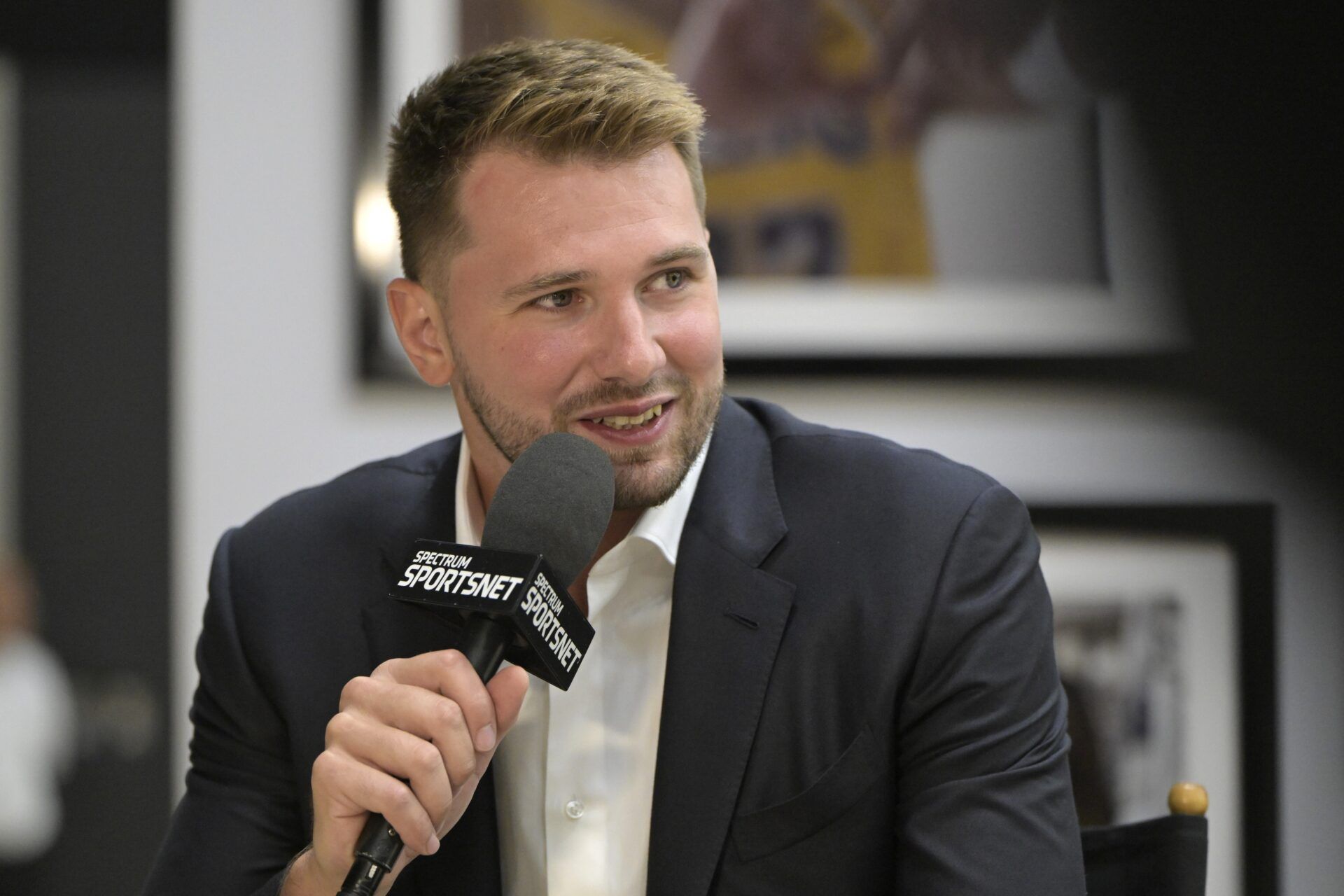 Los Angeles Lakers Luka Doncic (77) is interviewed Spectrum SportsNet following a press conference announcing the signing of his contract extension at UCLA Health Training Center.