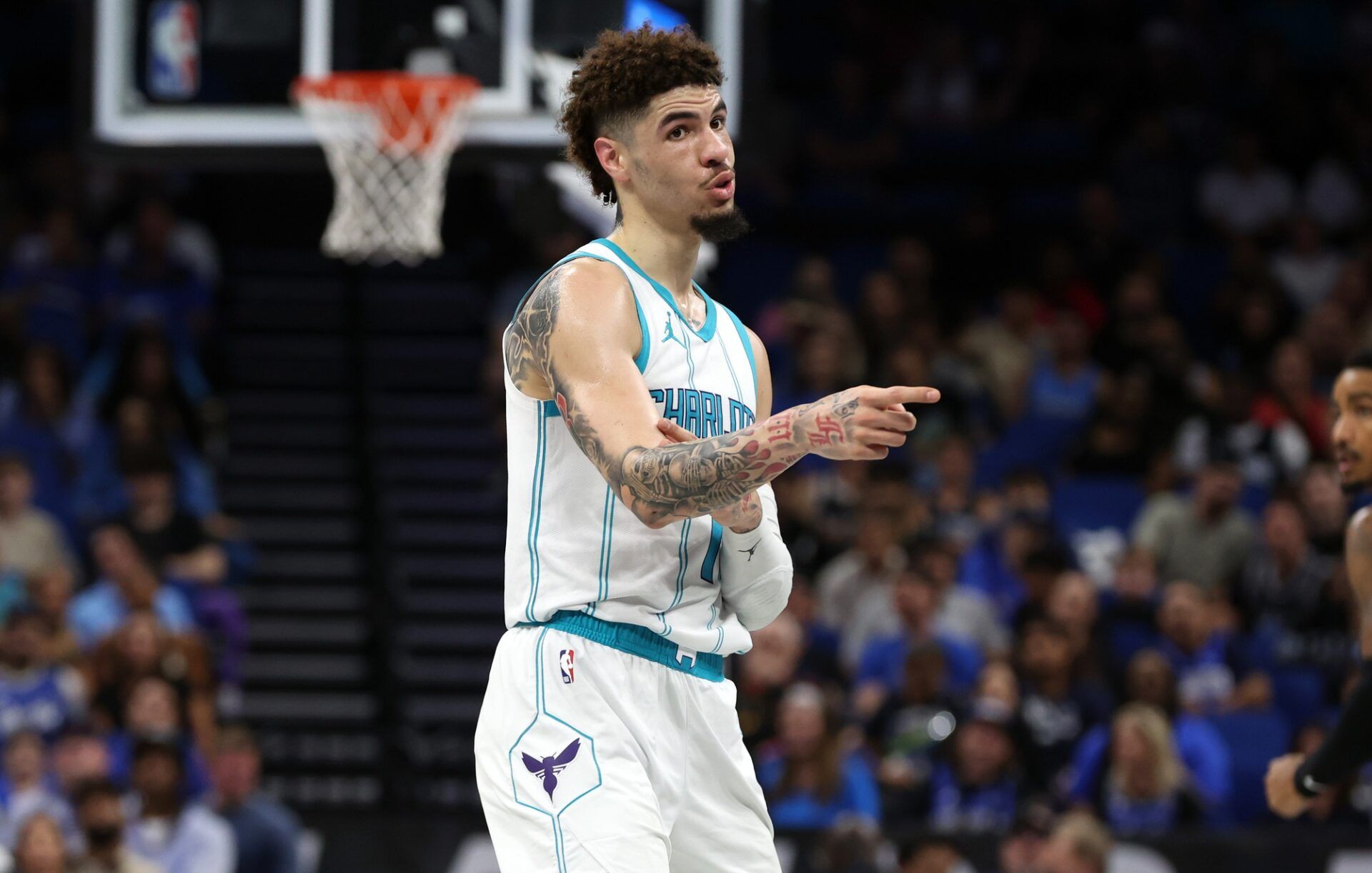 Charlotte Hornets guard LaMelo Ball (1) celebrates after he makes a three point basket against the Orlando Magic during the first quarter at Kia Center.