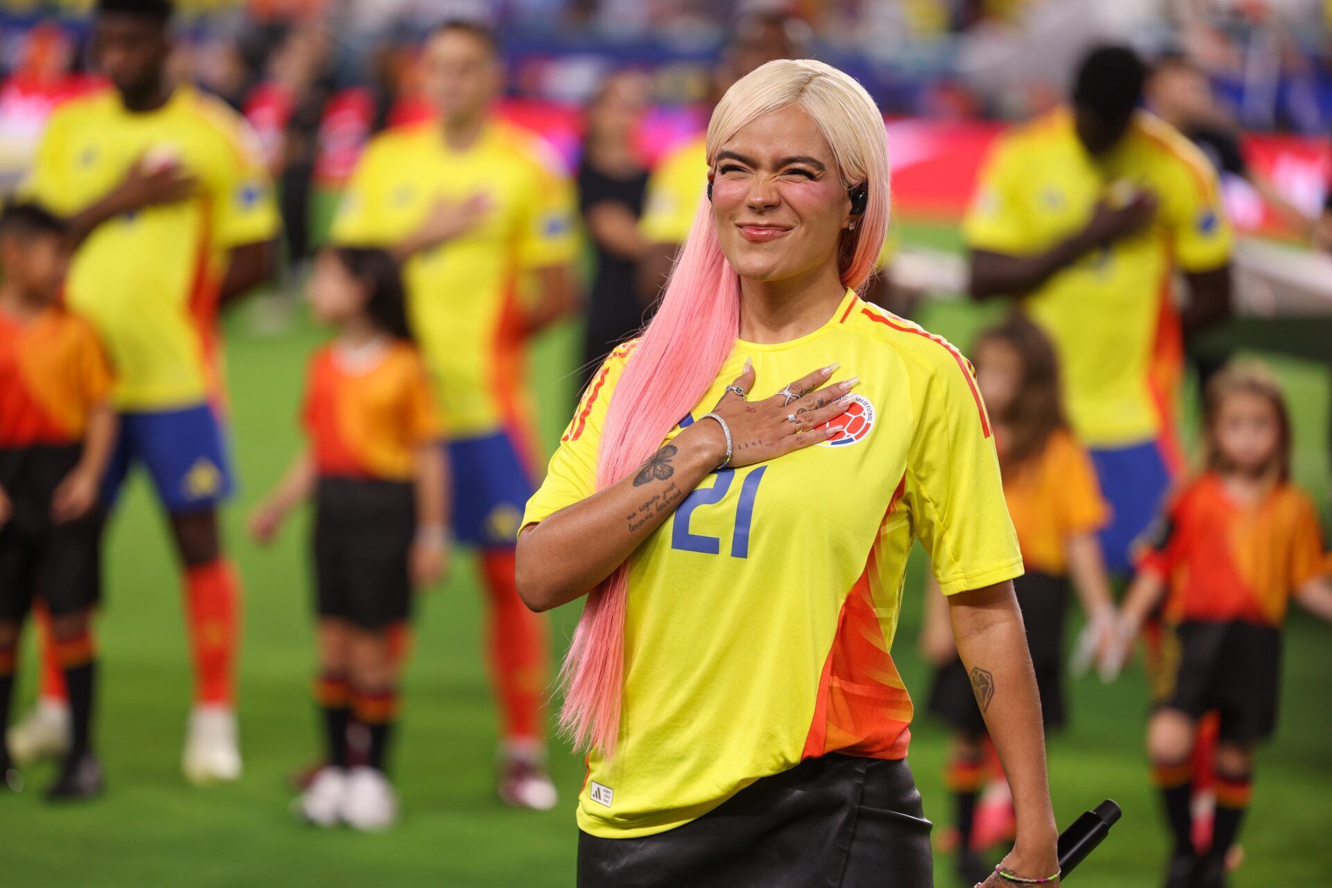 Colombian singer Karol G performs the national anthem of Colombia before the Copa America Final against Argentina at Hard Rock Stadium.