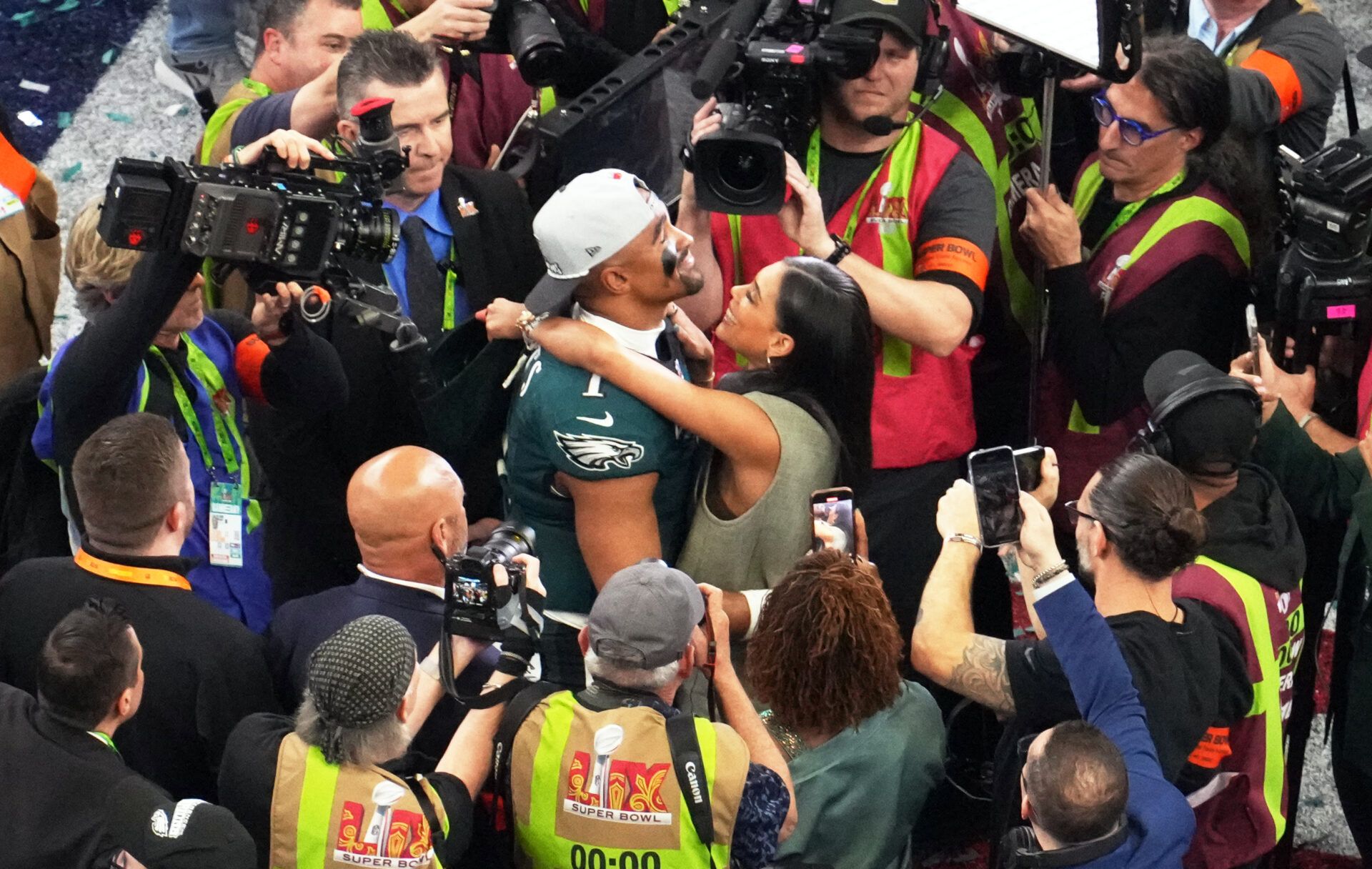 Philadelphia Eagles quarterback Jalen Hurts (1) reacts with his fiancee Bry Burrows after the Eagles defeated the Chiefs 40-22 in Super Bowl LIX at Caesars Superdome.