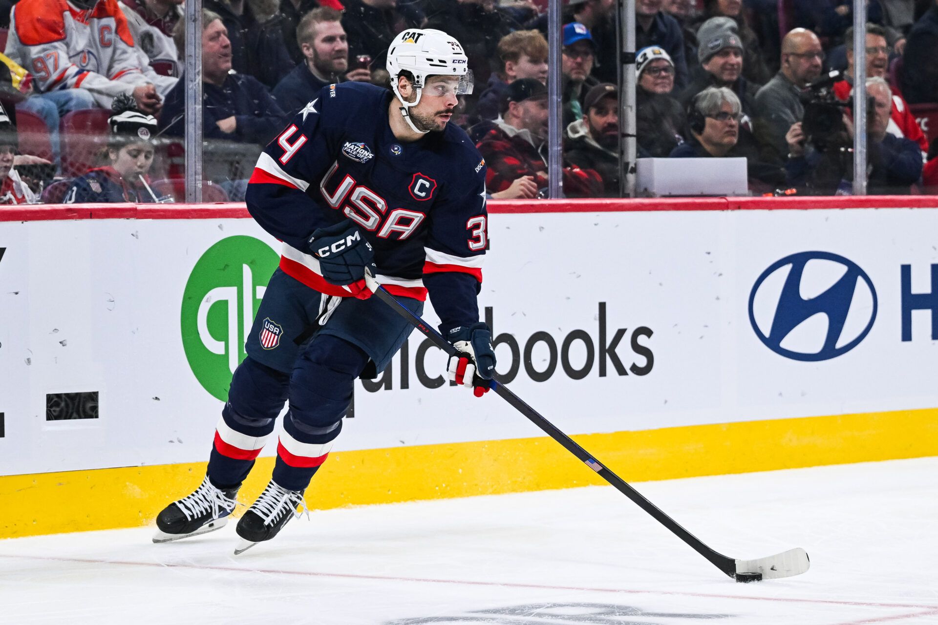 [Imagn Images direct customers only] Team USA forward Auston Matthews (34) plays the puck against Team Finland in the second period during a 4 Nations Face-Off ice hockey game at Bell Centre.