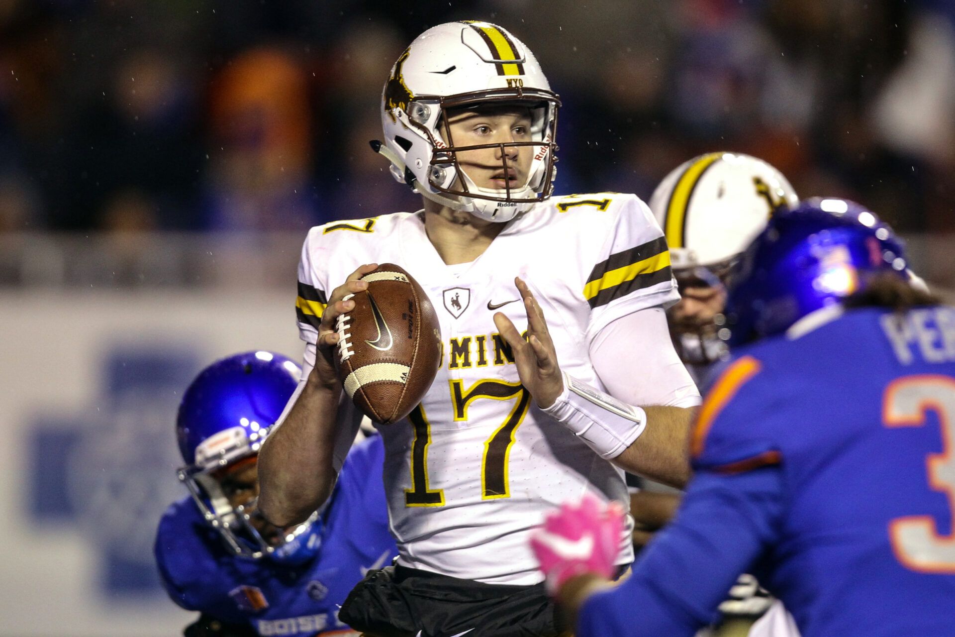 Wyoming Cowboys quarterback Josh Allen (17) drops back to pass against the Wyoming Cowboys during the second half at lbertsons Stadium. Boise State defeated Wyoming 24-14.
