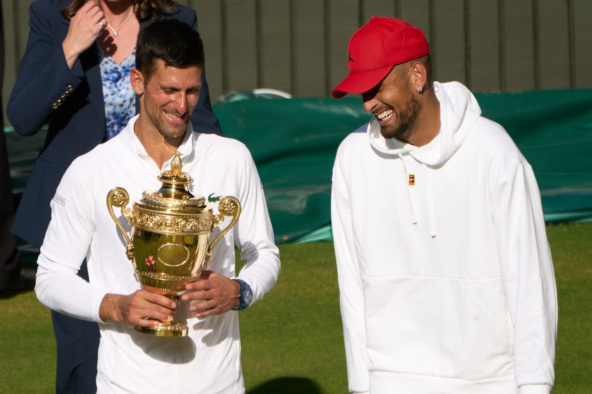 Novak Djokovic (SRB) talks with Nick Kyrgios (AUS) after winning his men’s singles final on Centre court at All England Lawn Tennis and Croquet Club.