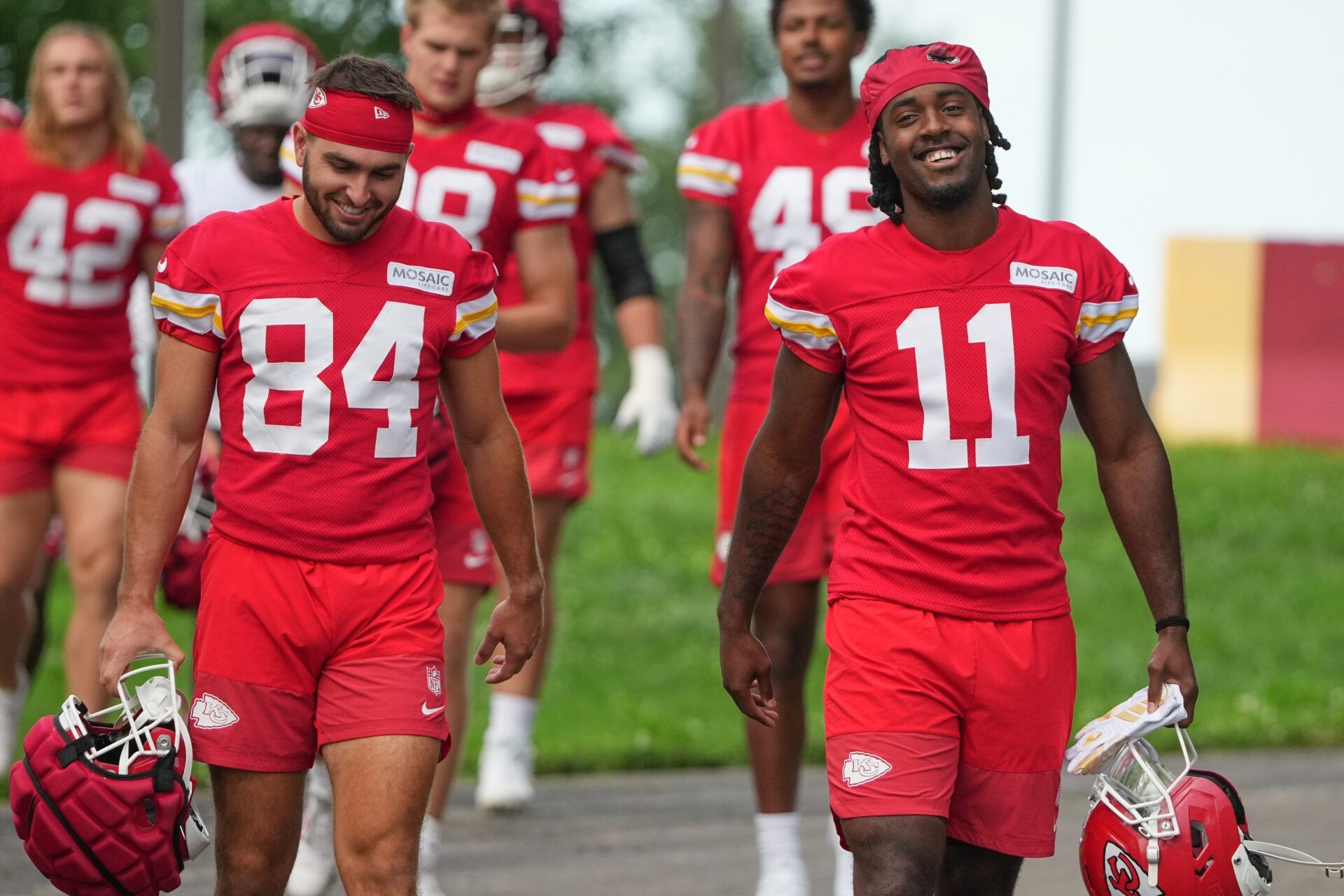Kansas City Chiefs wide receivers Mac Dalena (84) and Jalen Royals (11) walk down the hill to the practice fields during training camp at Missouri Western State University.