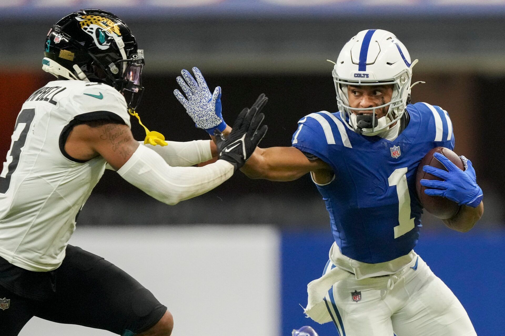 Indianapolis Colts wide receiver Josh Downs (1) reaches to push off Jacksonville Jaguars cornerback Tyson Campbell (3) on Sunday, Jan. 5, 2025, during a game against the Jacksonville Jaguars at Lucas Oil Stadium in Indianapolis.