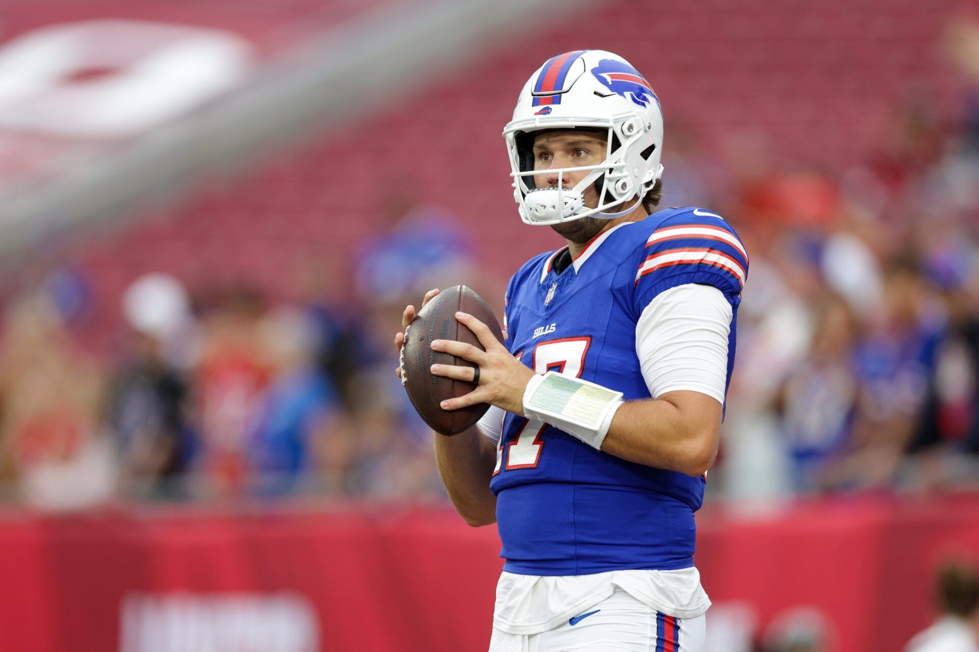 Buffalo Bills quarterback Josh Allen (17) warms up before a game against the Tampa Bay Buccaneers at Raymond James Stadium.