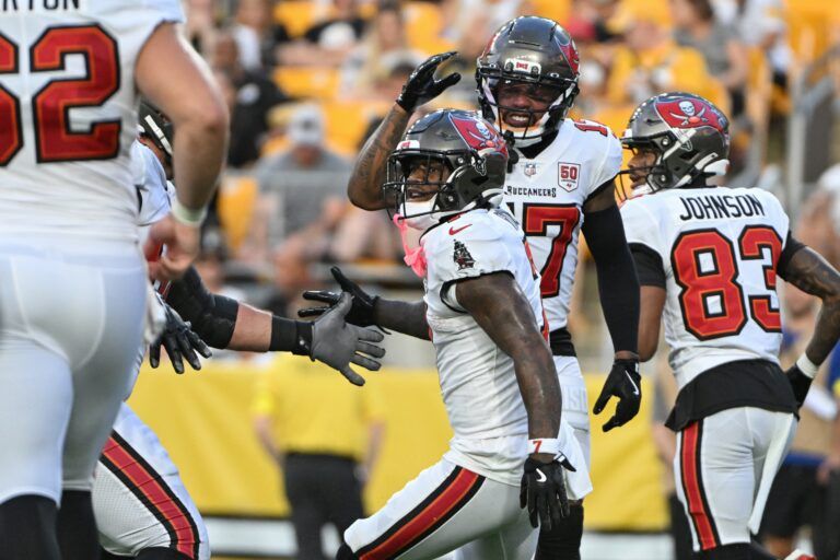 Tampa Bay Buccaneers running back Bucky Irving (7) celebrates his touchdown pass against the Pittsburgh Steelers during the first quarter at Acrisure Stadium.