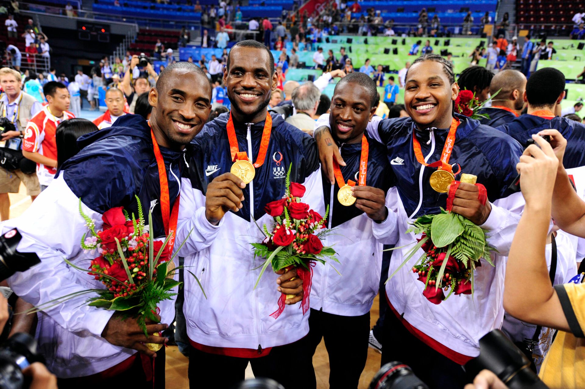 USA players Kobe Bryant (left), Lebron James (second left), Dwyane Wade (second right), and Carmelo Anthony pose with their gold medals following the mens basketball gold medal game against Spain at the Beijing Olympic Basketball Gymnasium during the 2008 Beijing Olympic Games.  USA beat Spain 118-107 to win the gold medal.