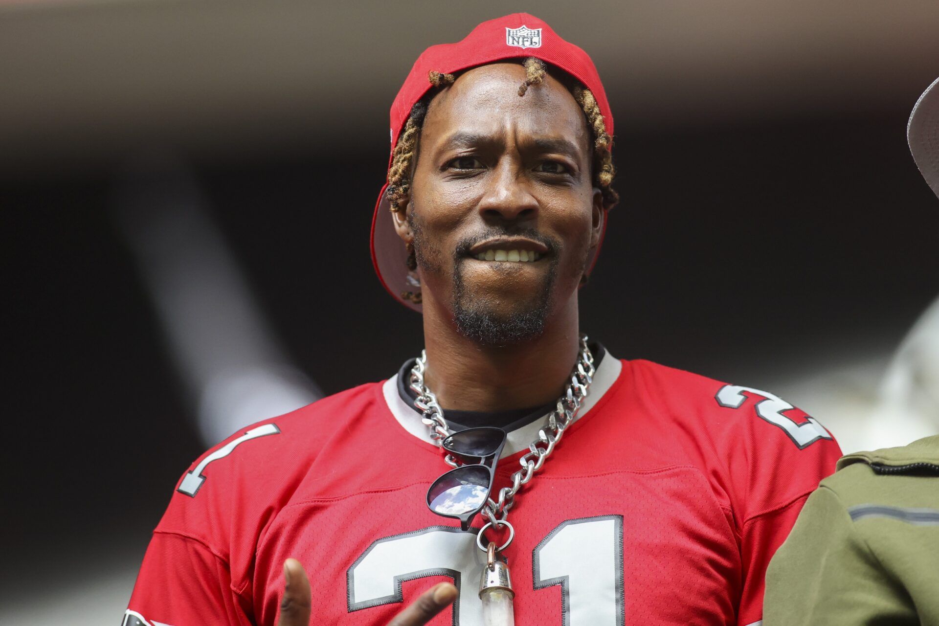 NBA player Dwight Howard watches a game between the Atlanta Falcons and Los Angeles Chargers in the second half at Mercedes-Benz Stadium.