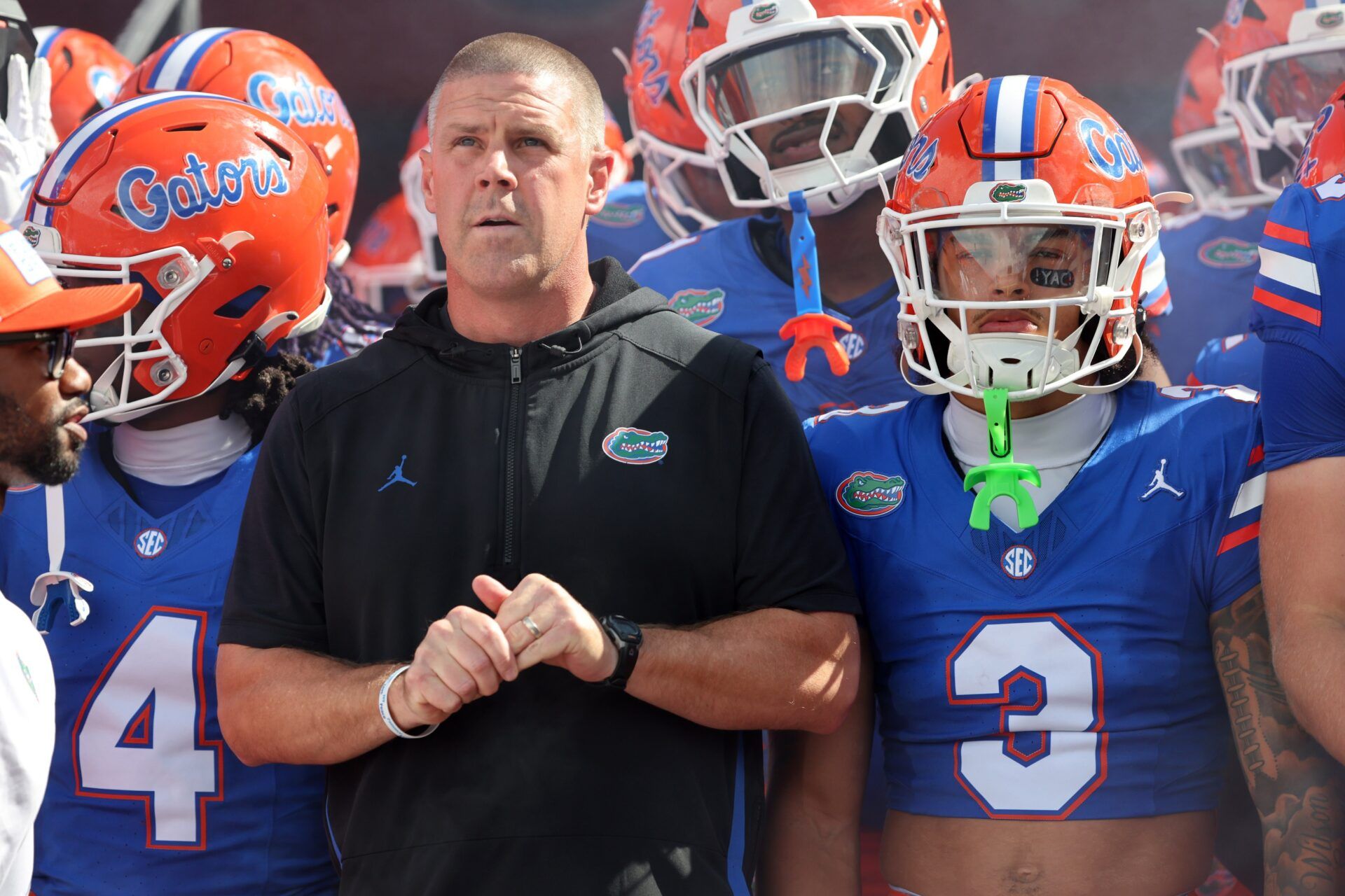 Florida Gators head coach Billy Napier and teammates run out of the tunnel prior to the game against the South Florida Bulls at Ben Hill Griffin Stadium.
