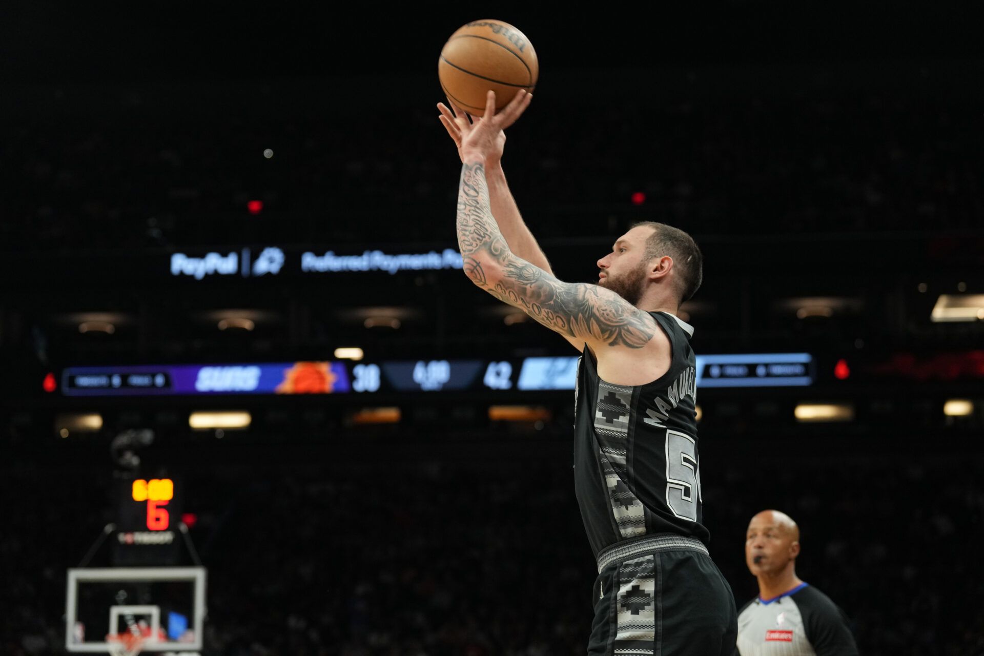 San Antonio Spurs forward Sandro Mamukelashvili (54) shoots against the Phoenix Suns during the first half at Footprint Center.