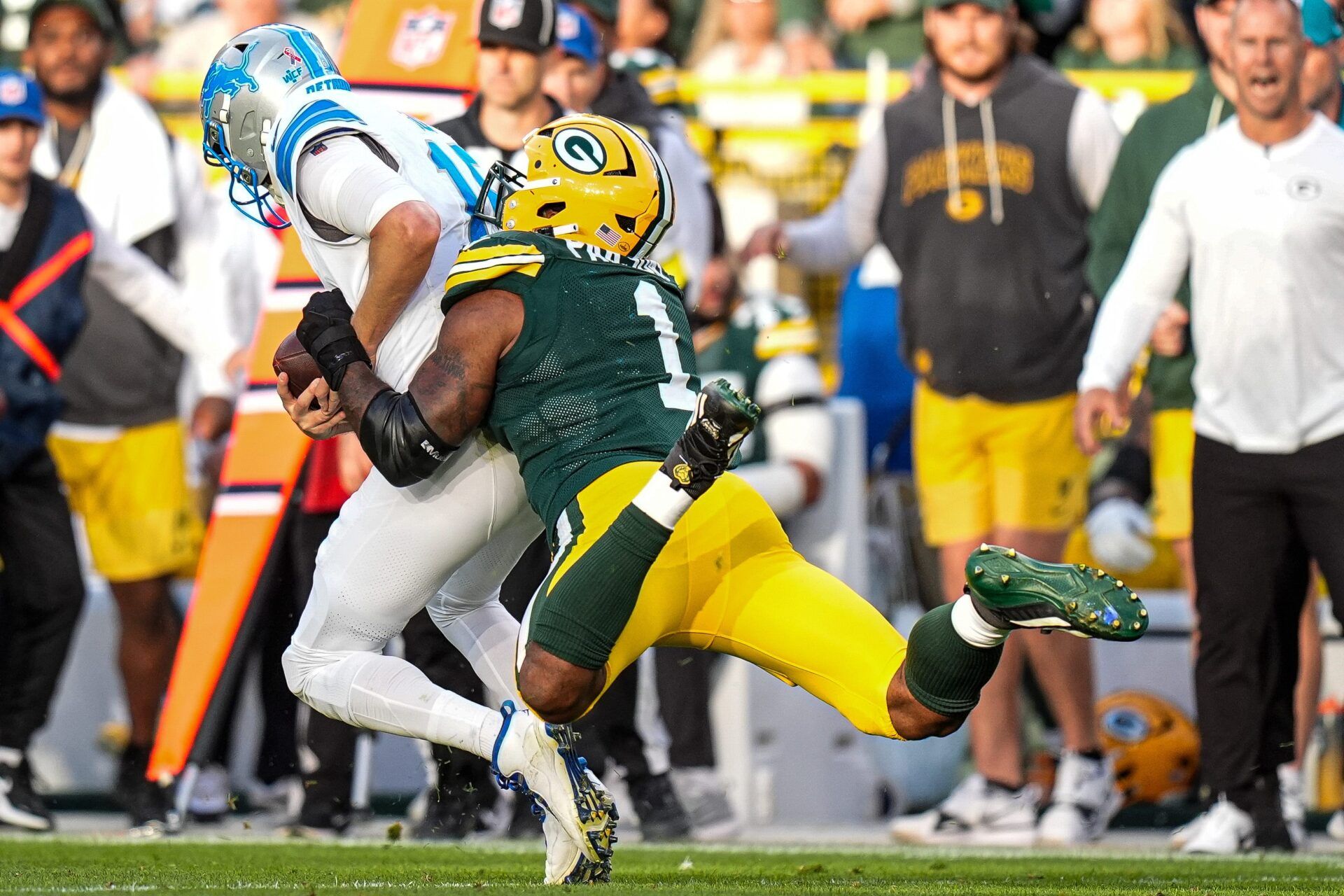Detroit Lions quarterback Jared Goff (16) is sacked by Green Bay Packers defensive end Micah Parsons (1) during the second half at Lambeau Field in Green Bay, Wis., on Sunday, September 7, 2025.