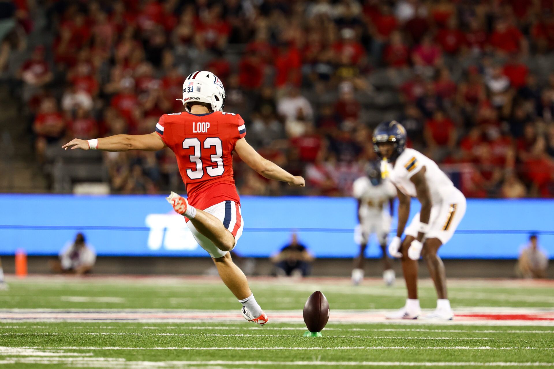 Arizona Wildcats Tyler Loop (33) goes to kick the bal during kickoff against Northern Arizona Lumberjacks during first quarter at Arizona Stadium.