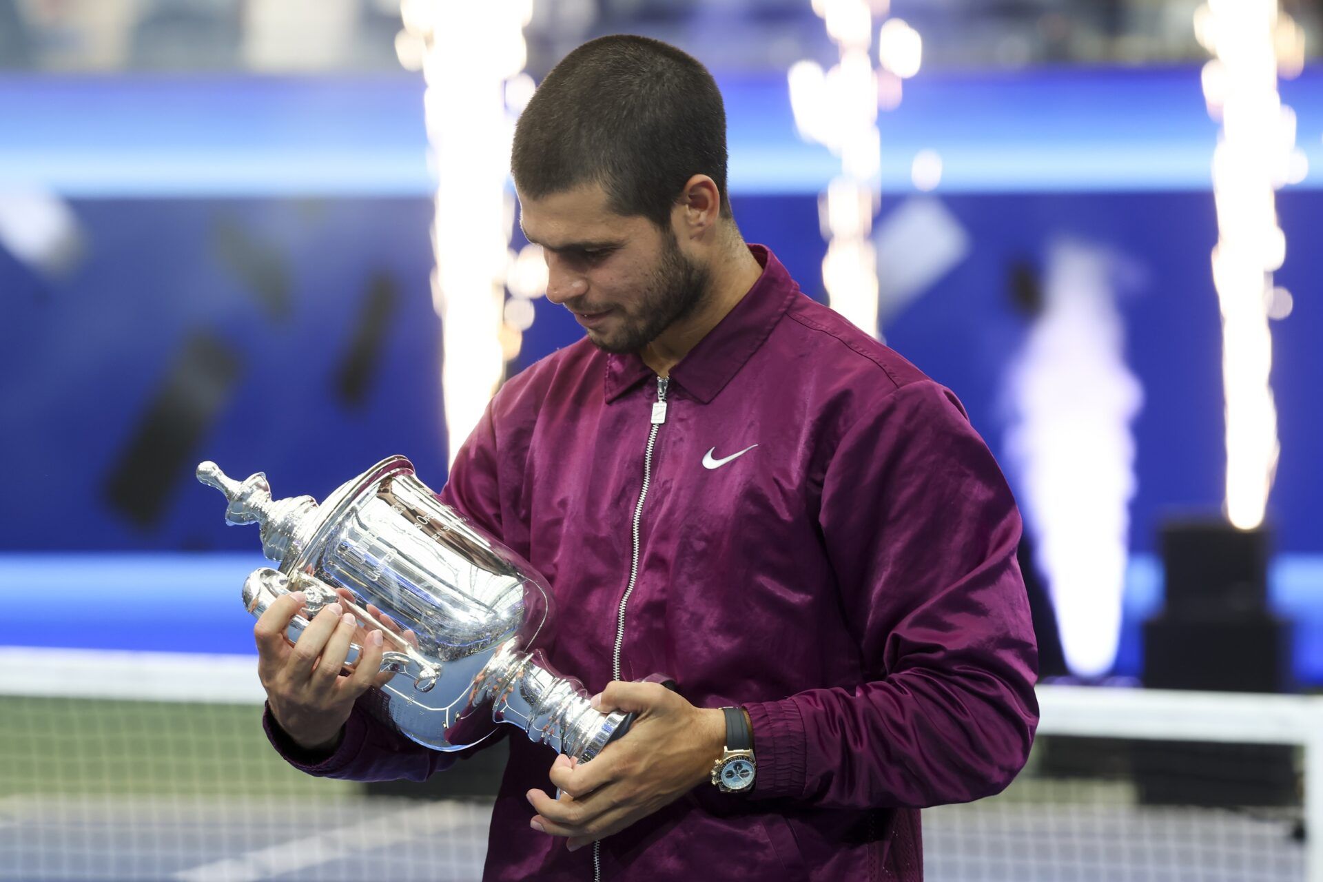 Carlos Alcaraz (ESP) looks at the trophy after winning the final of mens singles at Billie Jean King National Tennis Center.