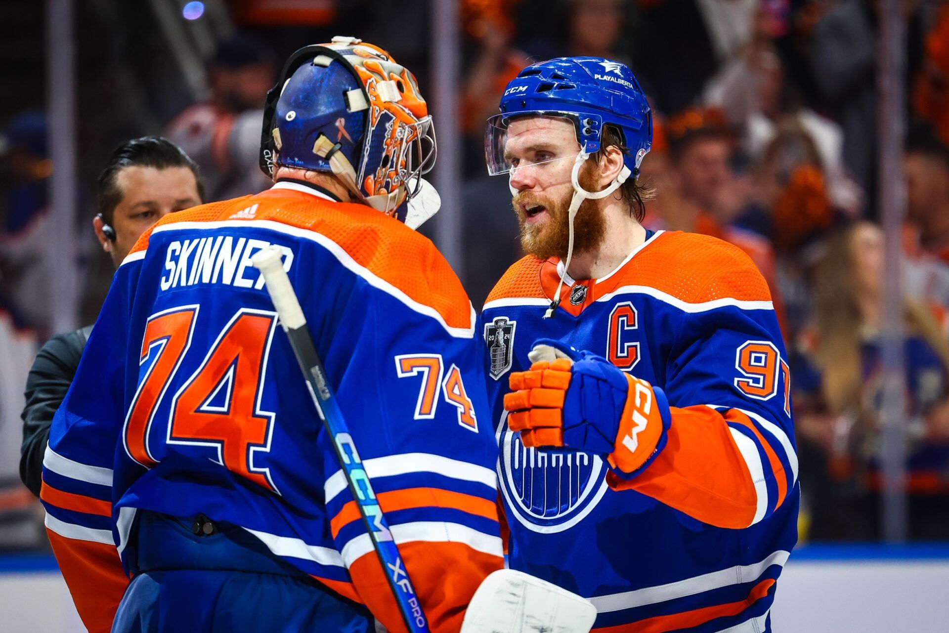 Edmonton Oilers goaltender Stuart Skinner (74) and center Connor McDavid (97) celebrates win after defeating Florida Panthers in game six of the 2024 Stanley Cup Final at Rogers Place.