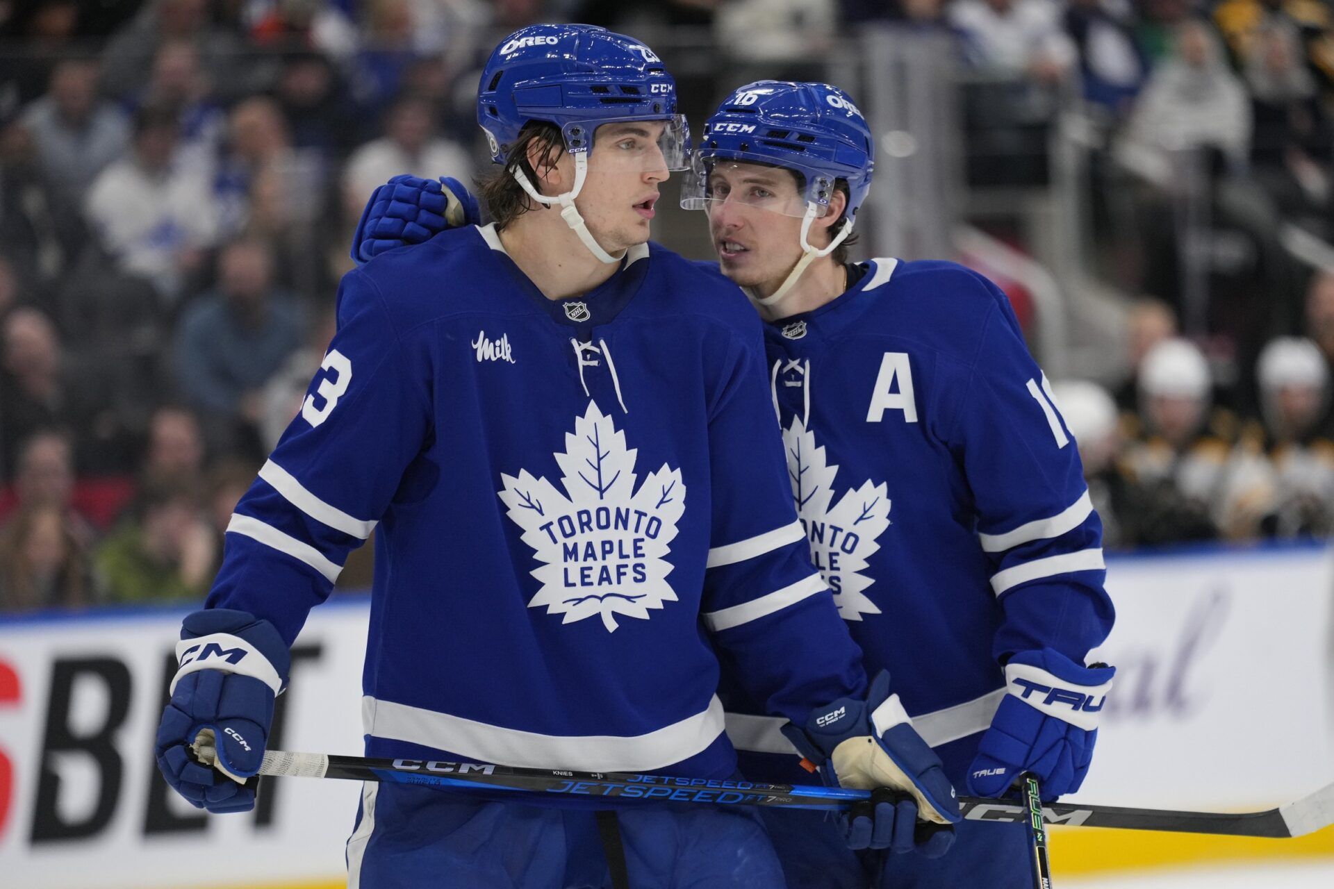 Toronto Maple Leafs forward Mitch Marner (16) talks to forward Matthew Knies (23) during a break in the action against the Boston Bruins during the third period at Scotiabank Arena.