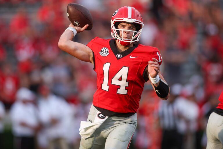 Georgia Bulldogs quarterback Gunner Stockton (14) throws a pass against the Austin Peay Governors in the fourth quarter at Sanford Stadium.