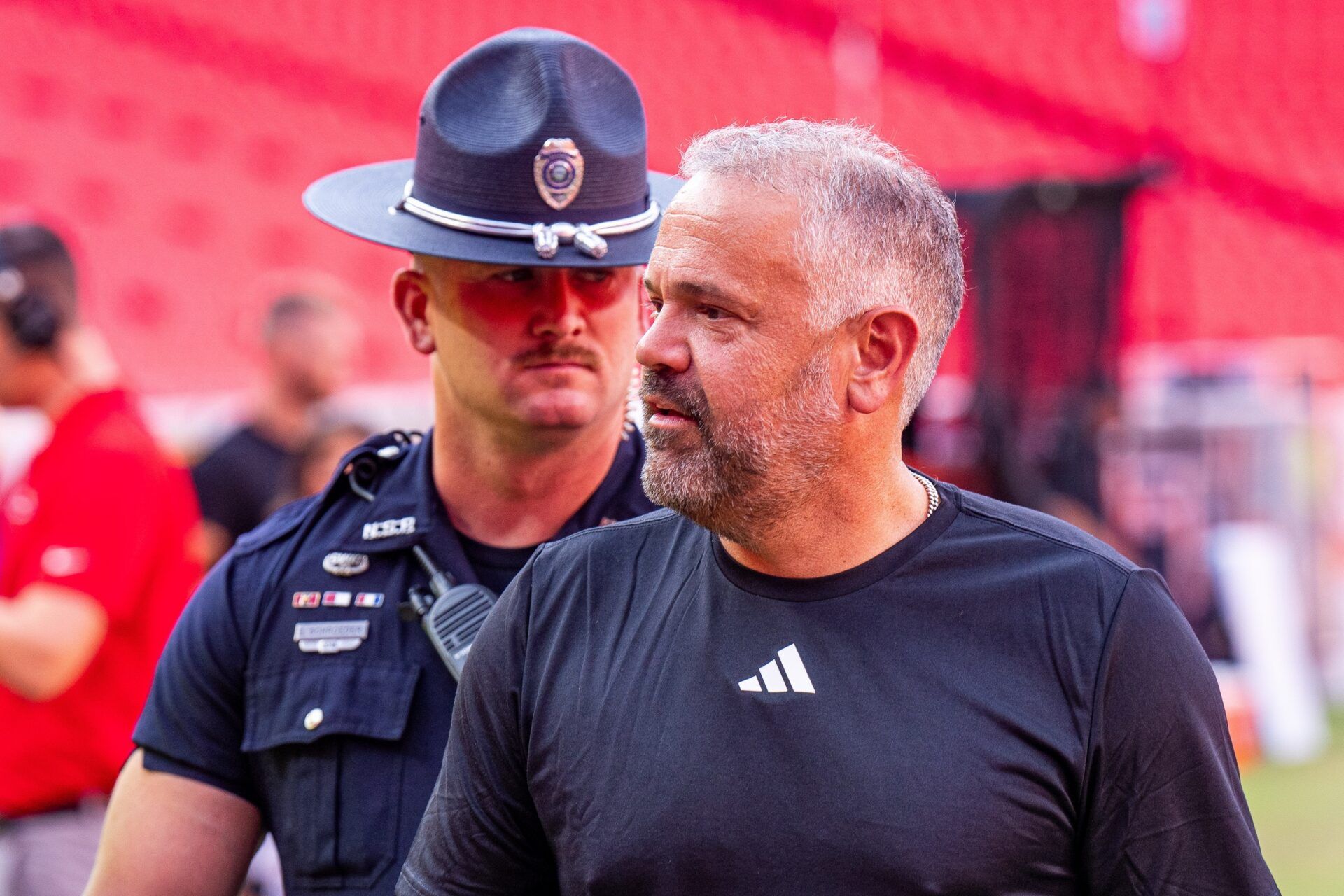 Nebraska Cornhuskers head coach Matt Rhule walks off the field during warmups before the game against the Cincinnati Bearcats at GEHA Field at Arrowhead Stadium.