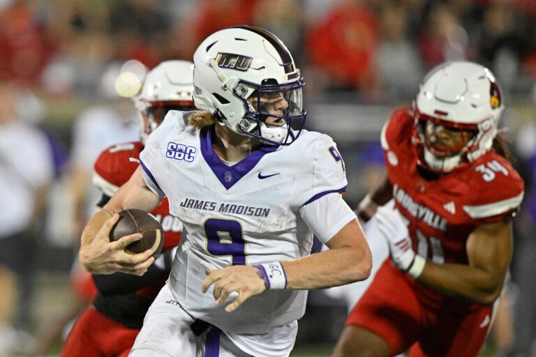 James Madison Dukes quarterback Matthew Sluka (9) runs the ball against the Louisville Cardinals during the second half at L&N Federal Credit Union Stadium.