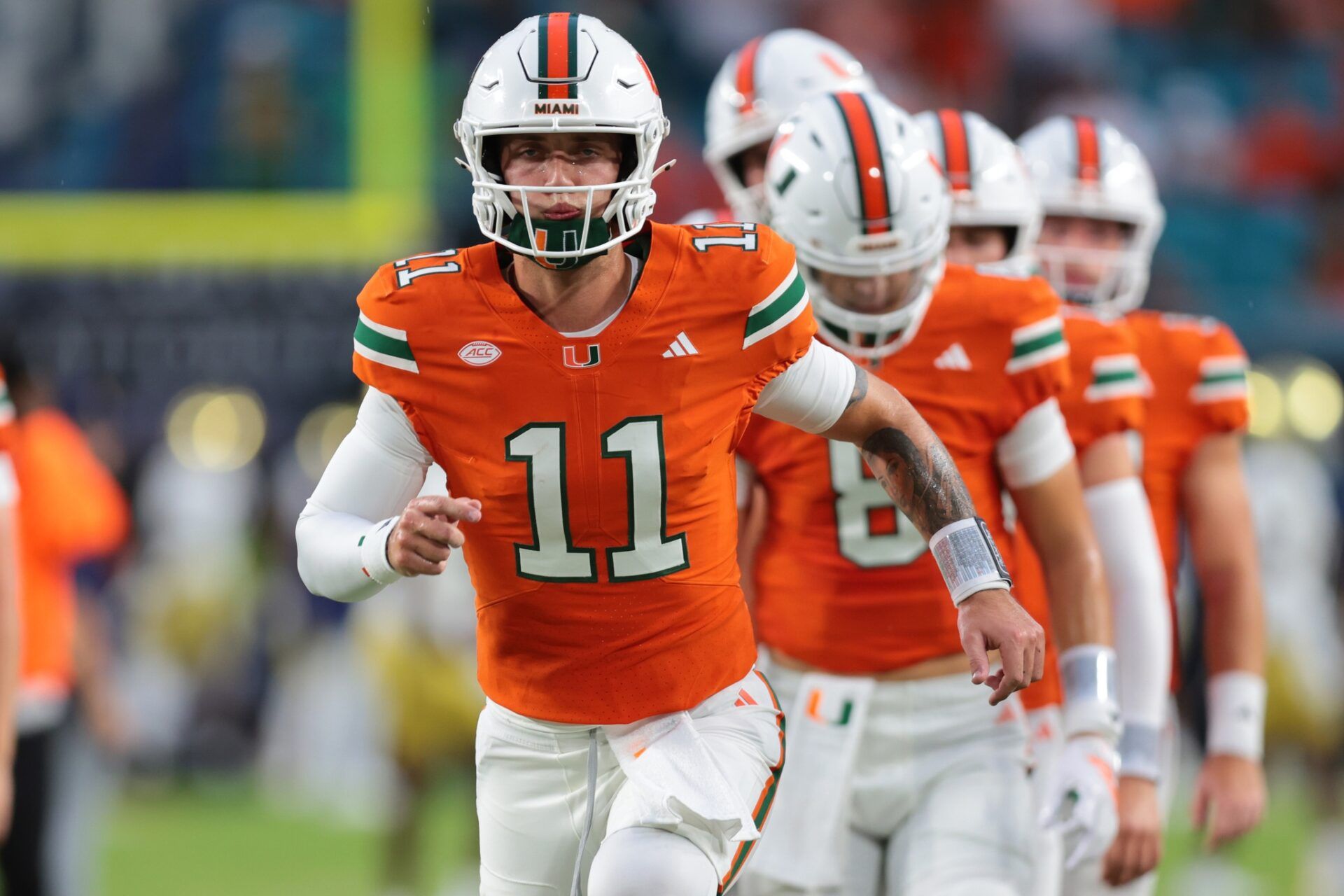 Miami Hurricanes quarterback Carson Beck (11) practices before the game against the Notre Dame Fighting Irish at Hard Rock Stadium.