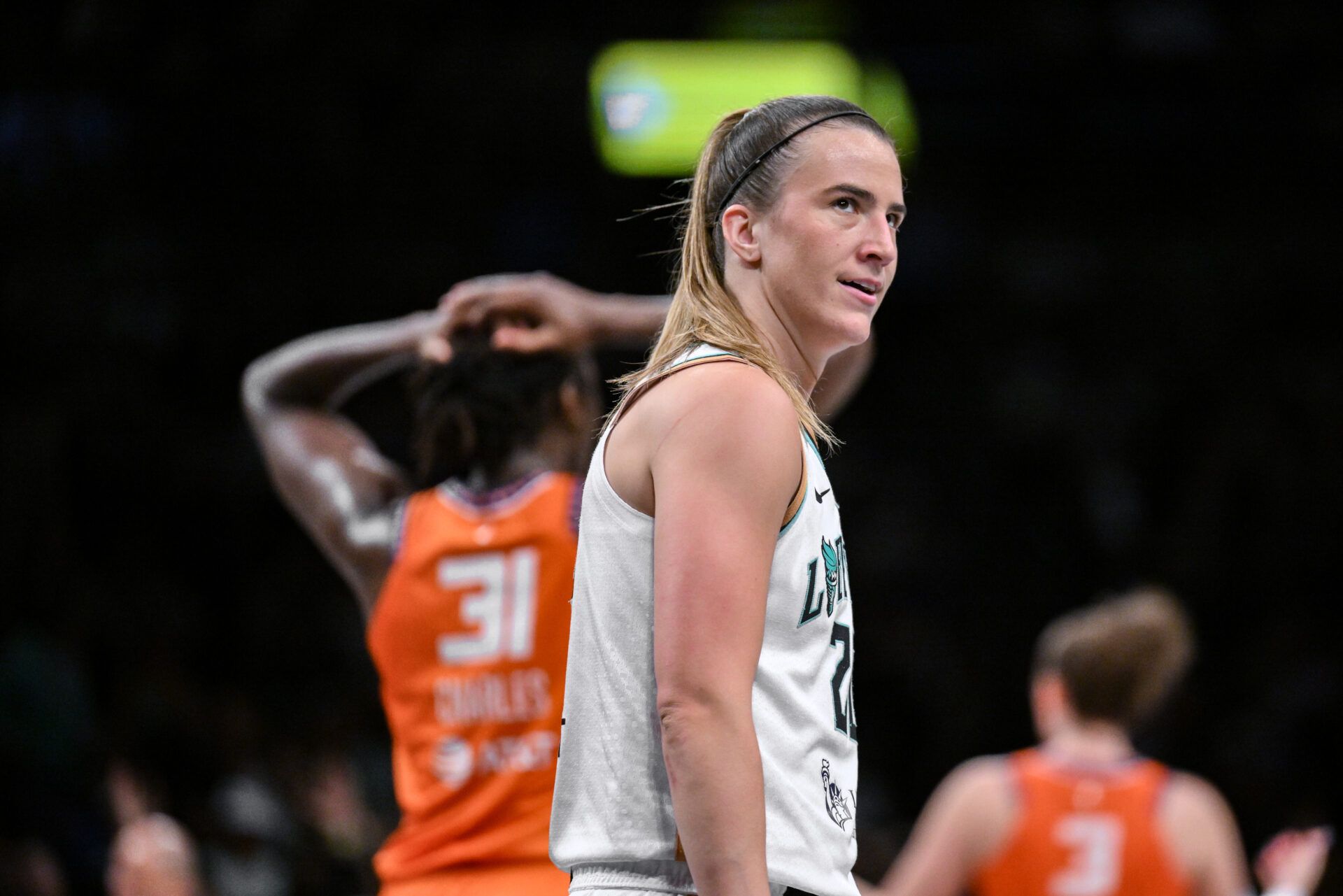 Aug 25, 20a25; Brooklyn, New York, USA; New York Liberty guard Sabrina Ionescu (20) reacts during the closing moments of the game against the Connecticut Sun at Barclays Center.