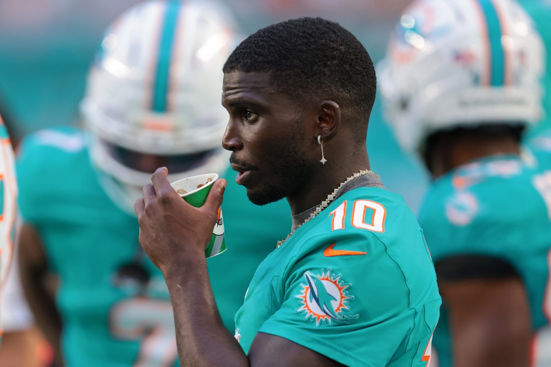 Miami Dolphins wide receiver Tyreek Hill (10) watches from the sideline against the Jacksonville Jaguars during the first quarter at Hard Rock Stadium.