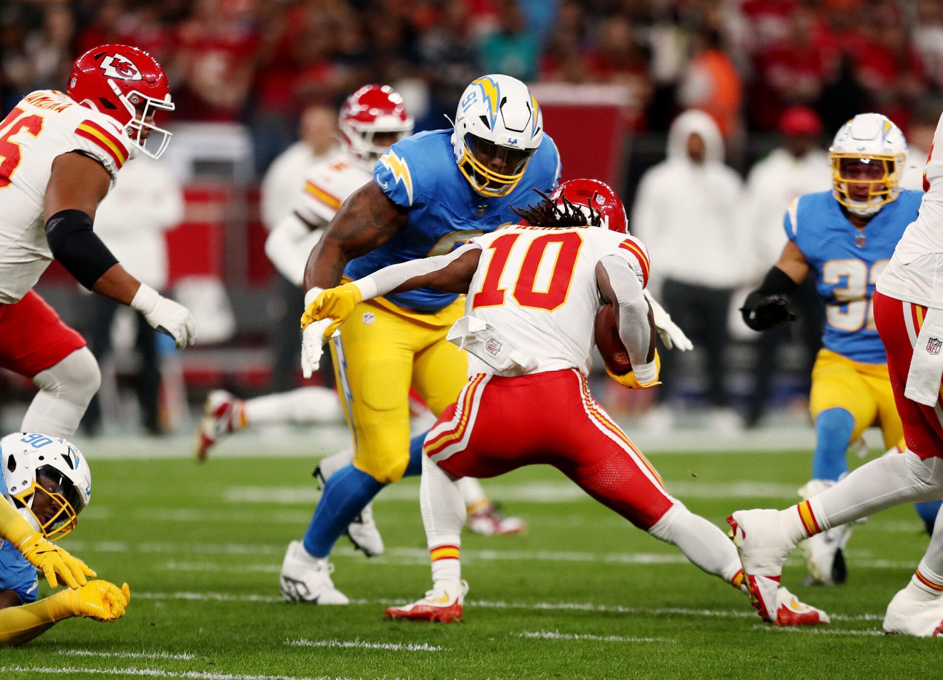 [US, Mexico & Canada customers only] Sep 5, 2025; Sao Paulo, BRAZIL;  Kansas City Chiefs running back Isiah Pacheco (10) runs against Los Angeles Chargers defensive tackle Da'Shawn Hand (91) in the first quarter during a NFL game at Corinthians Arena.