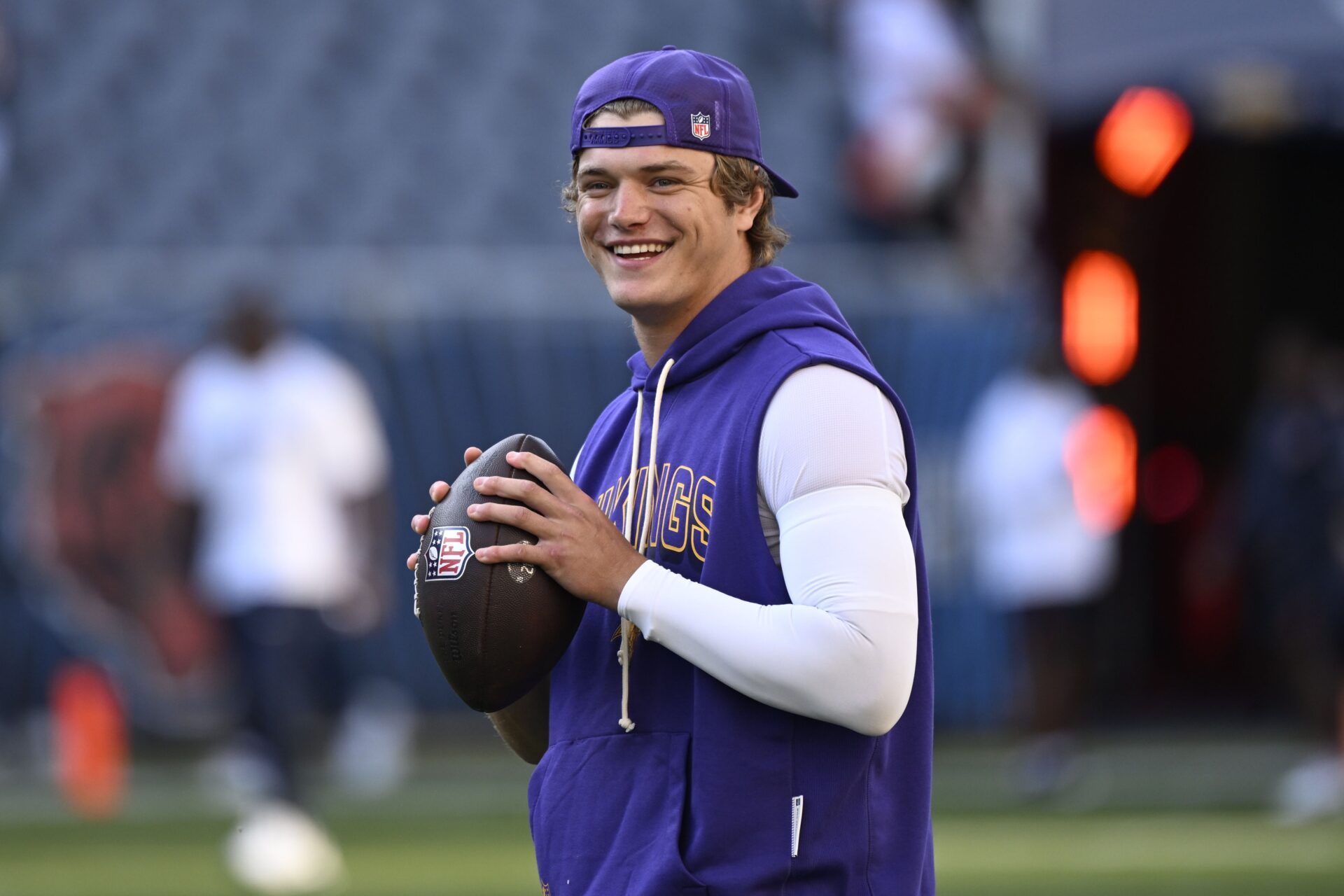 Minnesota Vikings quarterback J.J. McCarthy (9) practices before the game at Soldier Field.