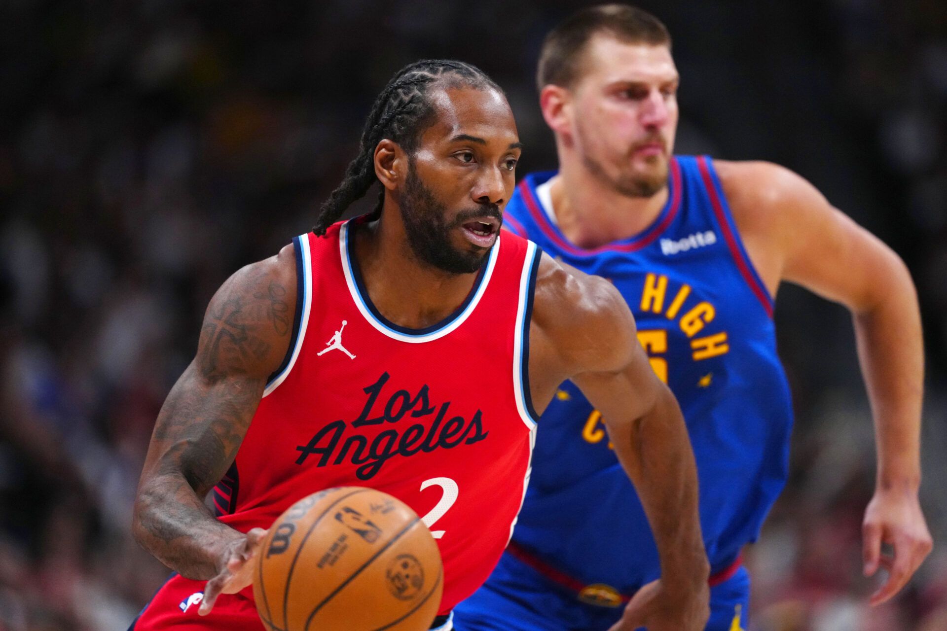 LA Clippers forward Kawhi Leonard (2) controls the ball in the first quarter against the Denver Nuggets during game seven of first round for the 2025 NBA Playoffs at Ball Arena.