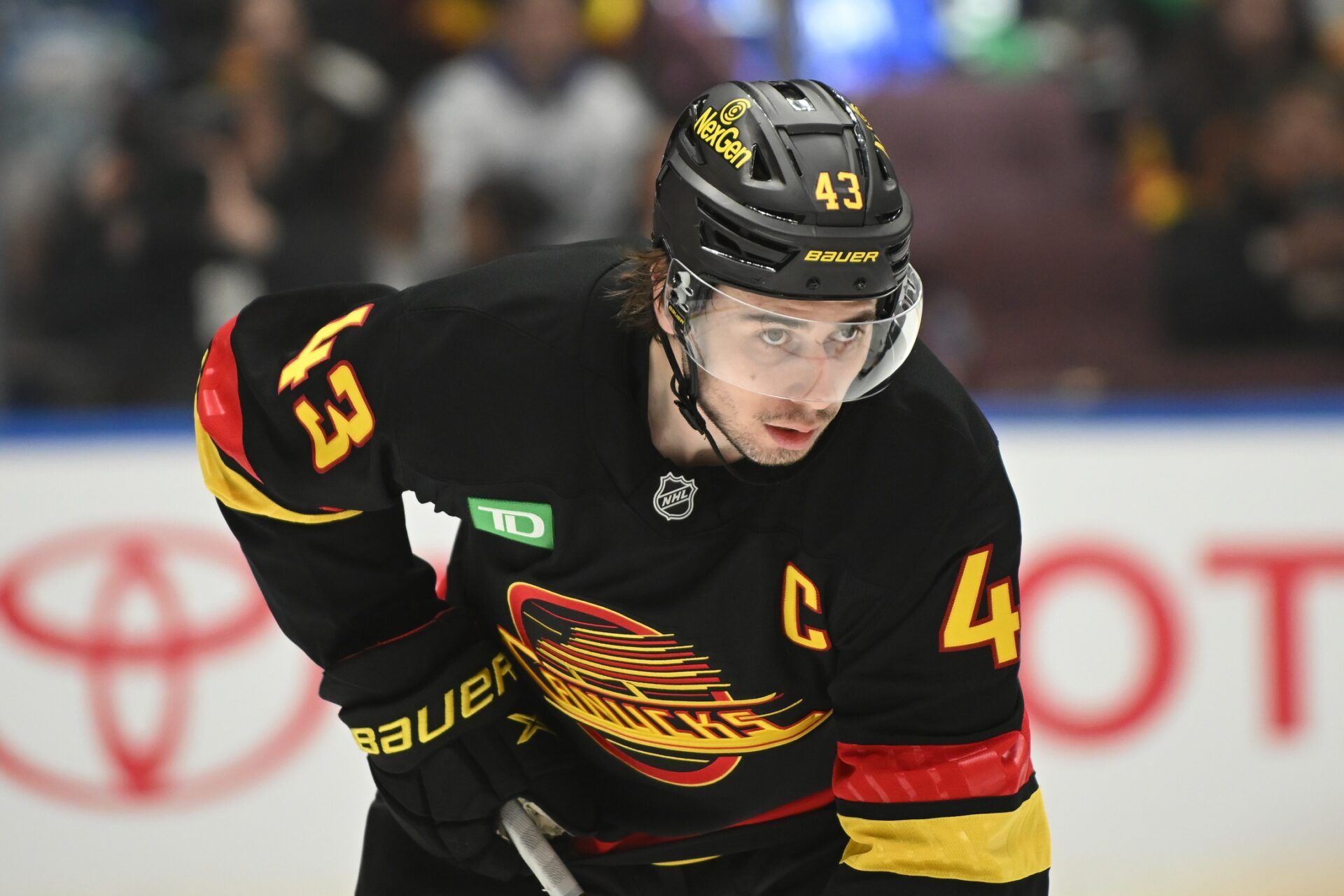 Vancouver Canucks defenseman Quinn Hughes (43) awaits the start of play  against the Anaheim Ducks during the first period at Rogers Arena.