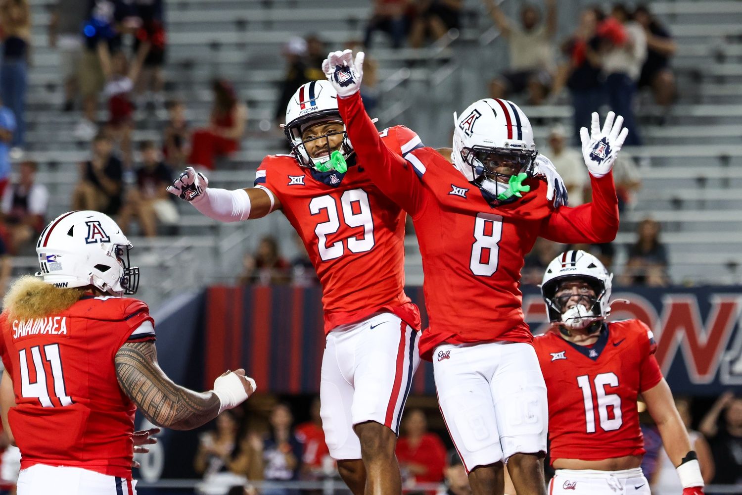 Arizona Wildcats defensive back Jay’Vion Cole (8) celebrates a touchdown with defensive back Devin Dunn (29) during the third quarter of the game against the Weber State Wildcats at Arizona Stadium.