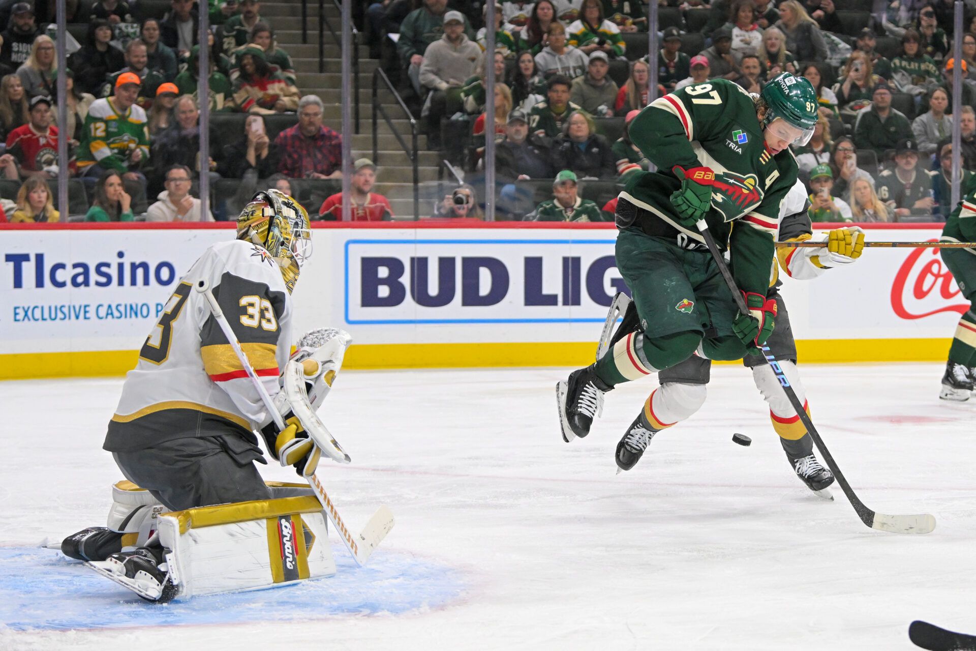 Minnesota Wild forward Kirill Kaprizov (97) jumps as he deflects a puck towards Vegas Golden Knights goalie Adin Hill (33) during the second period in game six of the first round of the 2025 Stanley Cup Playoffs at Xcel Energy Center.