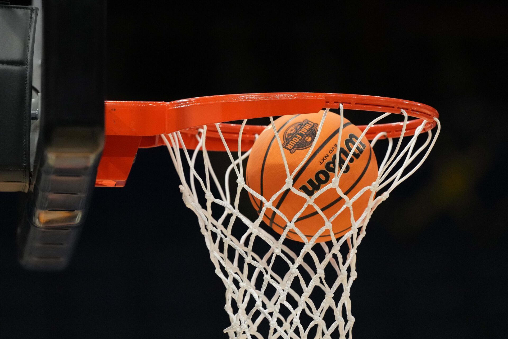 A Wilson EVO Nxt basketball ball with the 2025 NCAA Women's Final Four logo approaches the rim and the net at Amalie Arena.