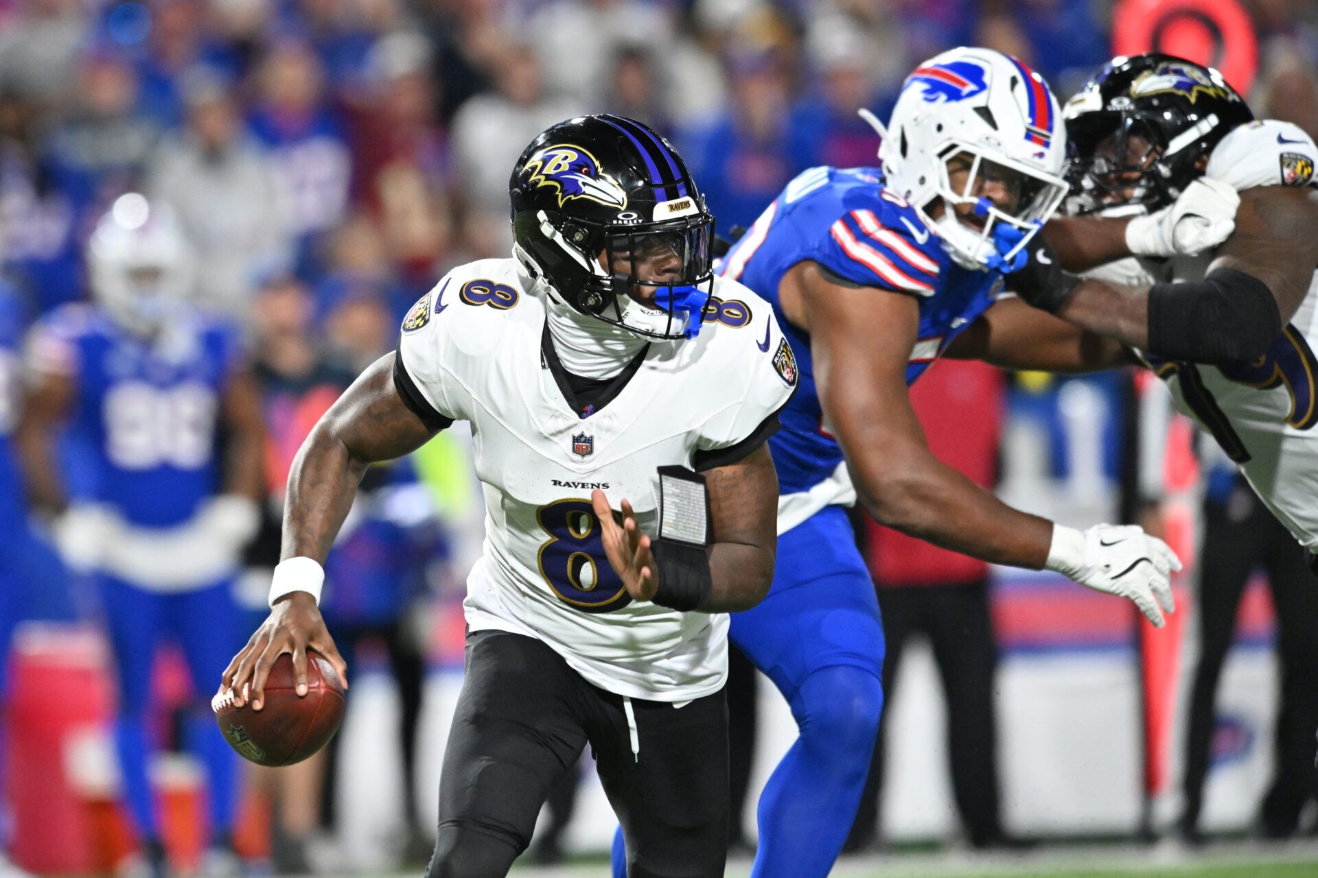 Baltimore Ravens quarterback Lamar Jackson (8) runs the ball during the fourth quarter against the Buffalo Bills at Highmark Stadium.