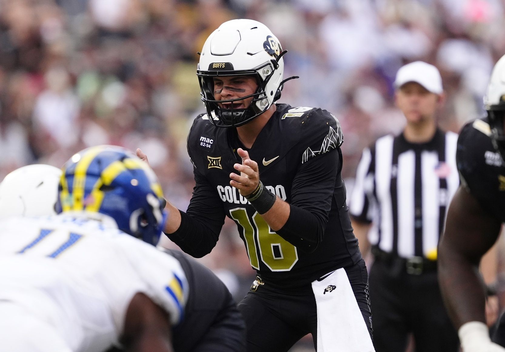 Colorado Buffaloes quarterback Ryan Staub (16) calls for the ball in the second half against the Delaware Fightin Blue Hens at Folsom Field.