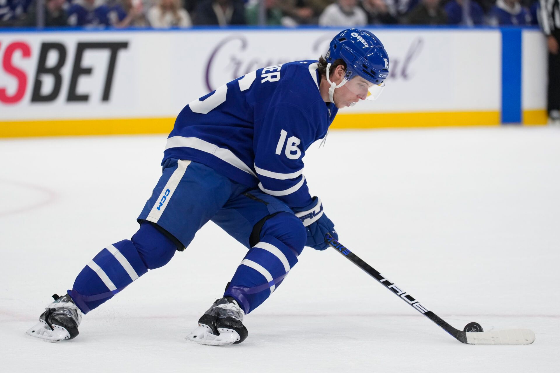Toronto Maple Leafs forward Mitch Marner (16) carries the puck against the Colorado Avalanche during the first period at Scotiabank Arena.