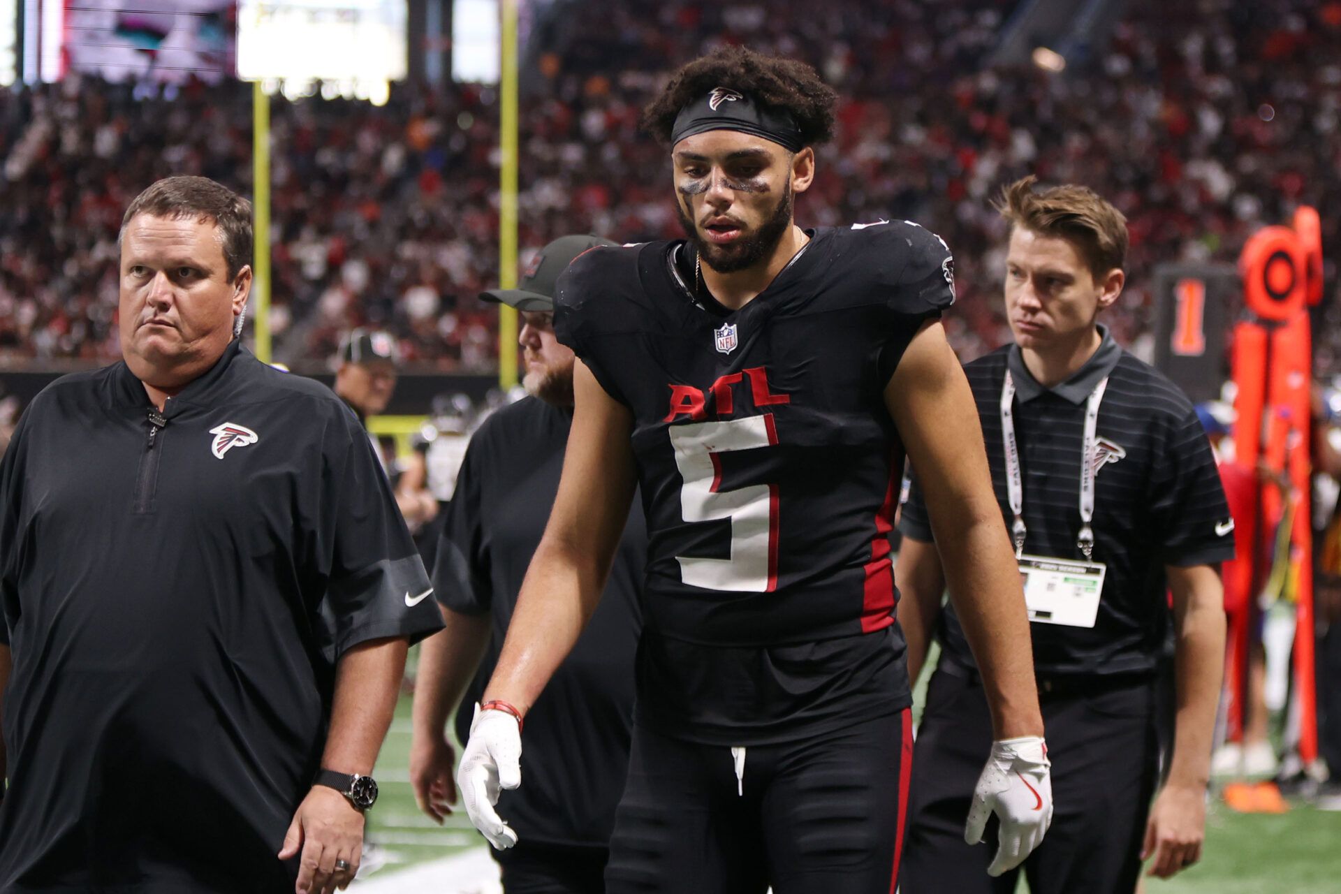 Atlanta Falcons wide receiver Drake London (5) walks off the field after their loss against the Tampa Bay Buccaneers at Mercedes-Benz Stadium.