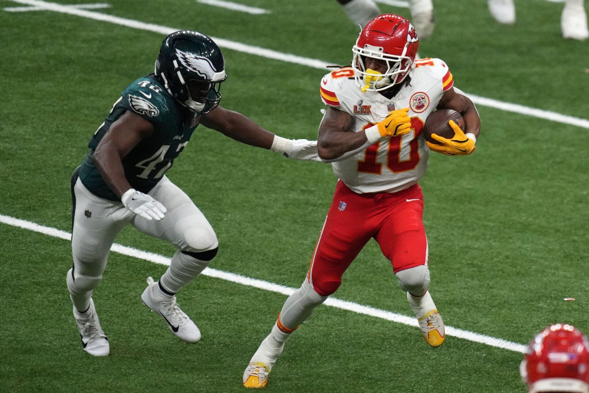 Kansas City Chiefs running back Isiah Pacheco (10) rushes the ball against Philadelphia Eagles linebacker Nicholas Morrow (43) during the fourth quarter in Super Bowl LIX  at Caesars Superdome.
