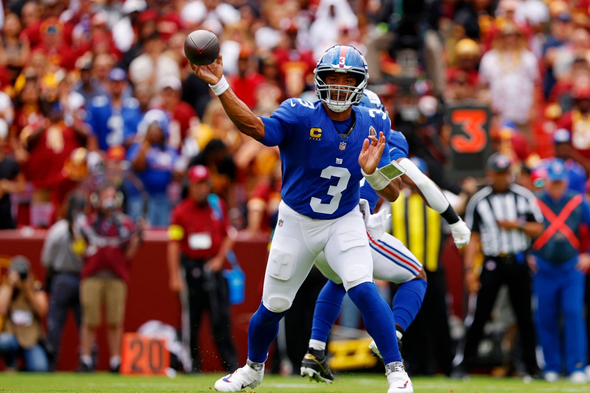 New York Giants quarterback Russell Wilson (3) makes a pass during the first quarter against the Washington Commanders at Northwest Stadium.