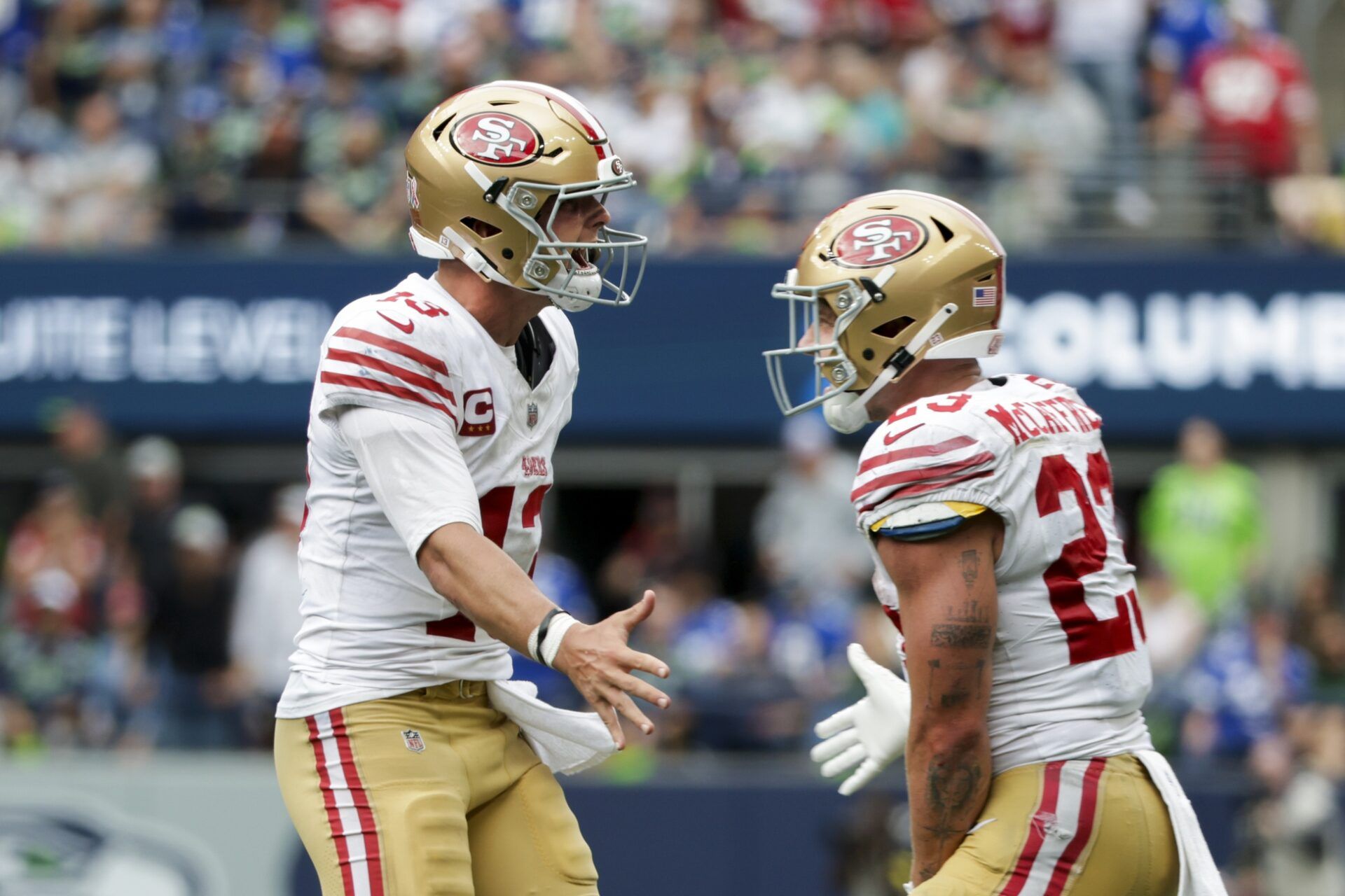 San Francisco 49ers quarterback Brock Purdy celebrates after throwing a touchdown pass against the Seattle Seahawks during the fourth quarter at Lumen Field.