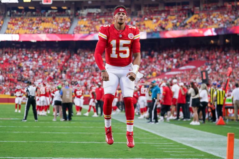 Kansas City Chiefs quarterback Patrick Mahomes (15) celebrates toward fans prior to a game at GEHA Field at Arrowhead Stadium.