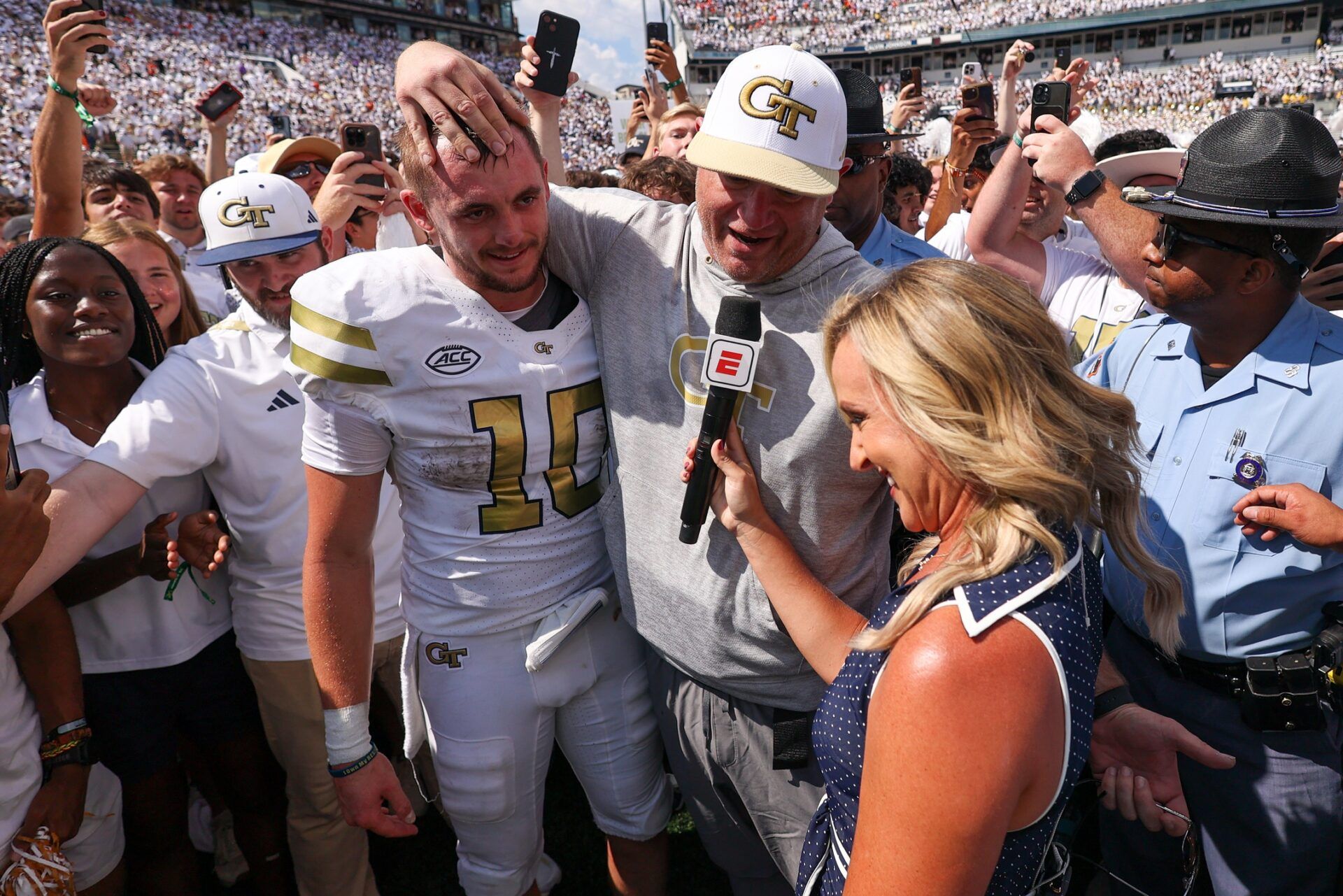 Georgia Tech Yellow Jackets quarterback Haynes King (10) and head coach Brent Key talk to a reporter after a victory over the Clemson Tigers at Bobby Dodd Stadium at Hyundai Field.