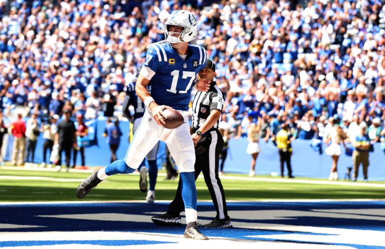Indianapolis Colts quarterback Daniel Jones (17) celebrates after a touchdown during the first half at Lucas Oil Stadium.